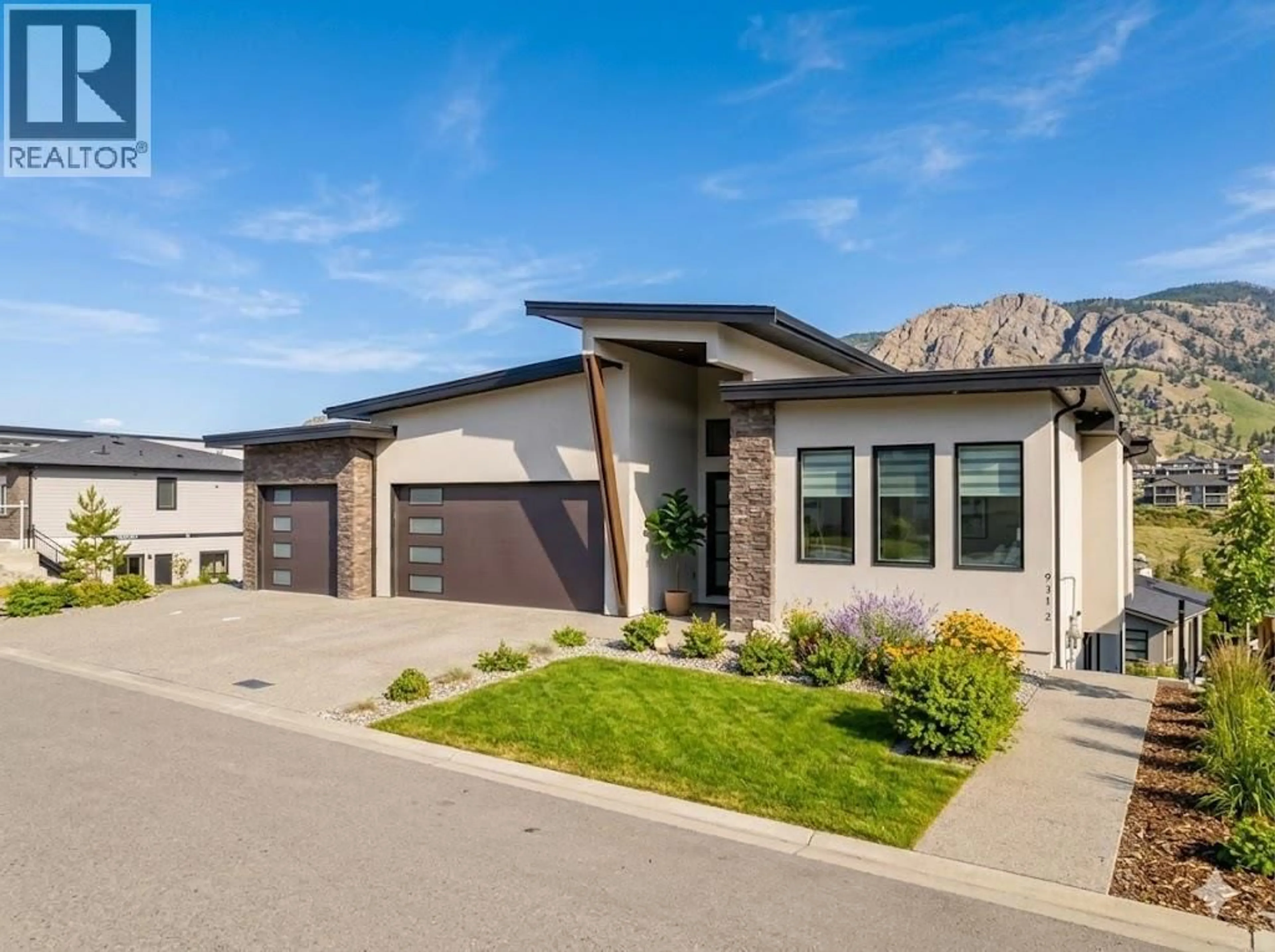 Home with brick exterior material, street for 937 ROYAL TROON LANE, Kelowna British Columbia V1P0A3