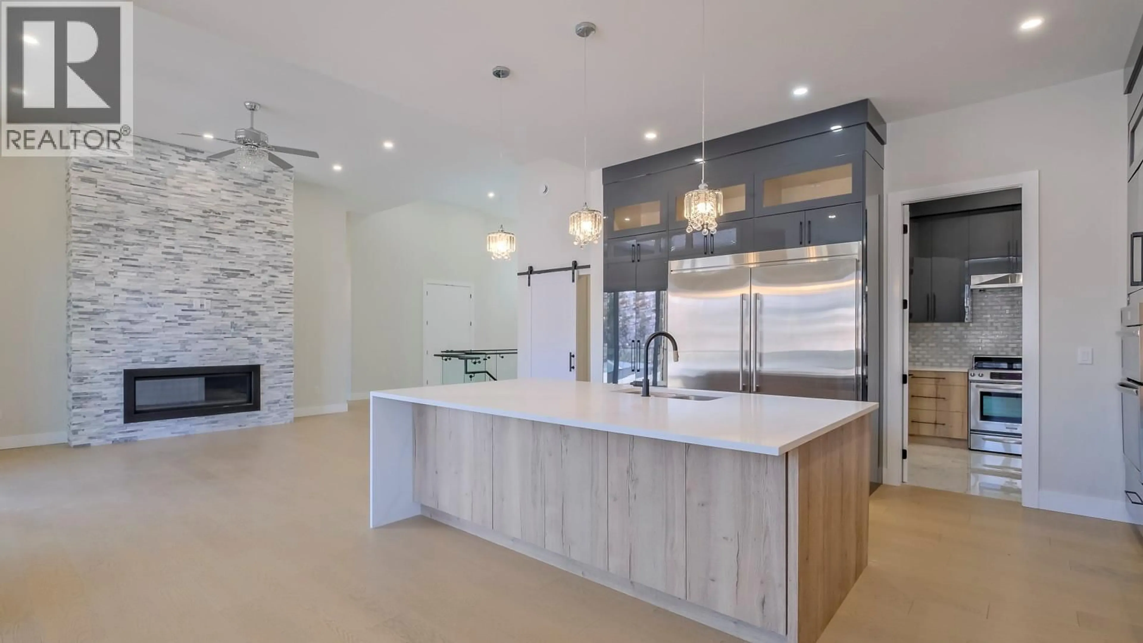 Contemporary kitchen, ceramic/tile floor for 937 ROYAL TROON LANE, Kelowna British Columbia V1P0A3