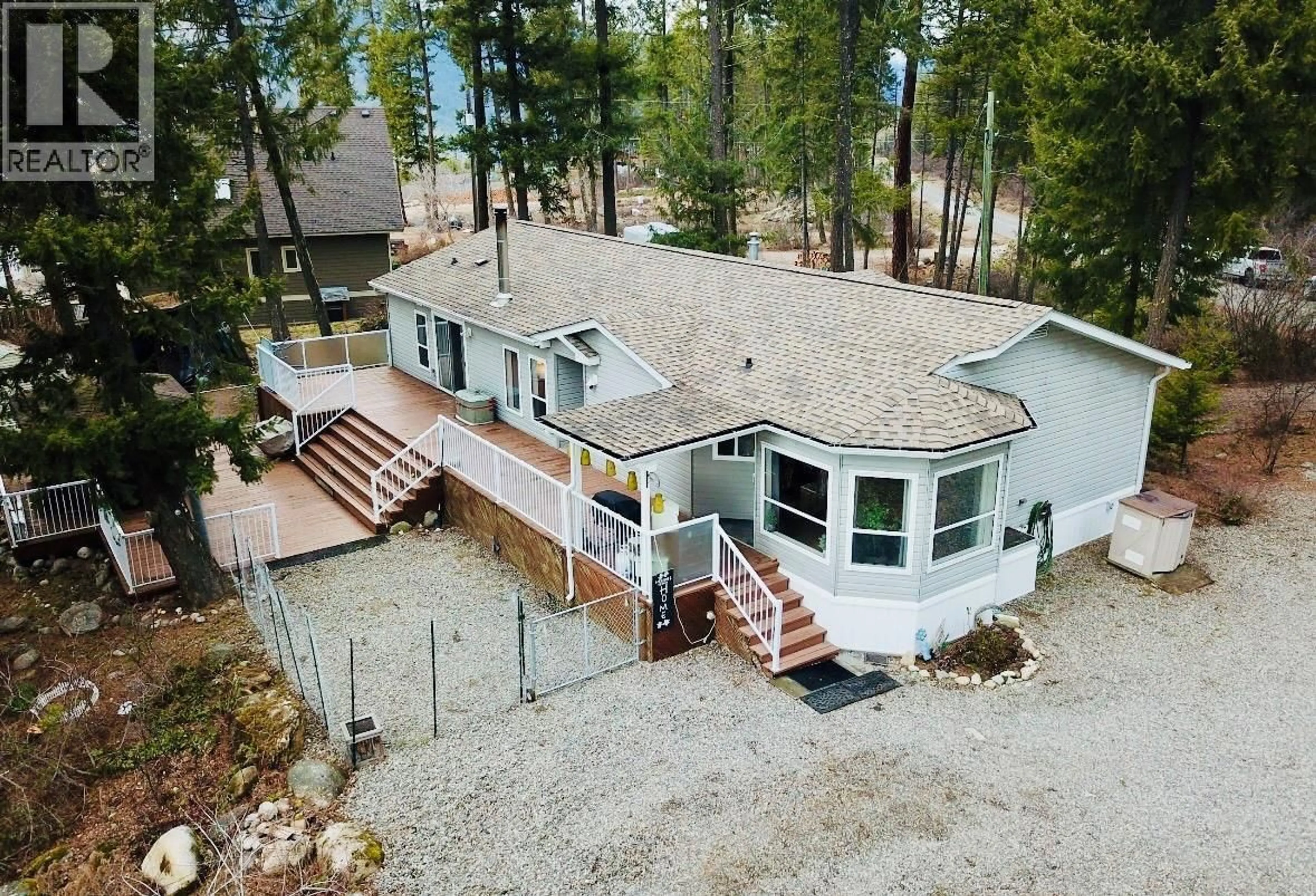 A pic from outside/outdoor area/front of a property/back of a property/a pic from drone, water/lake/river/ocean view for 7743 MCRAE ROAD, Christina Lake British Columbia V0H1E0