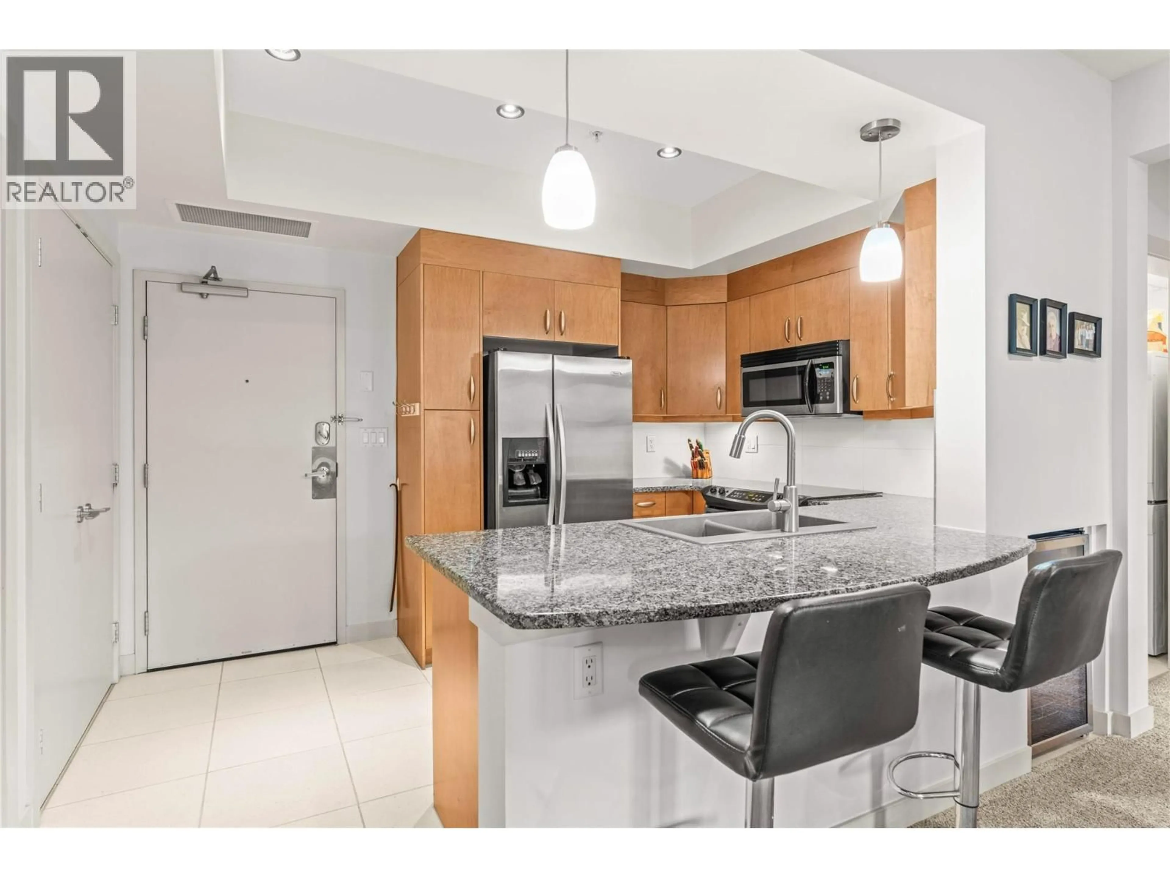 Open concept kitchen, ceramic/tile floor for 1112 - 7343 OKANAGAN LANDING ROAD, Vernon British Columbia V1H2J6