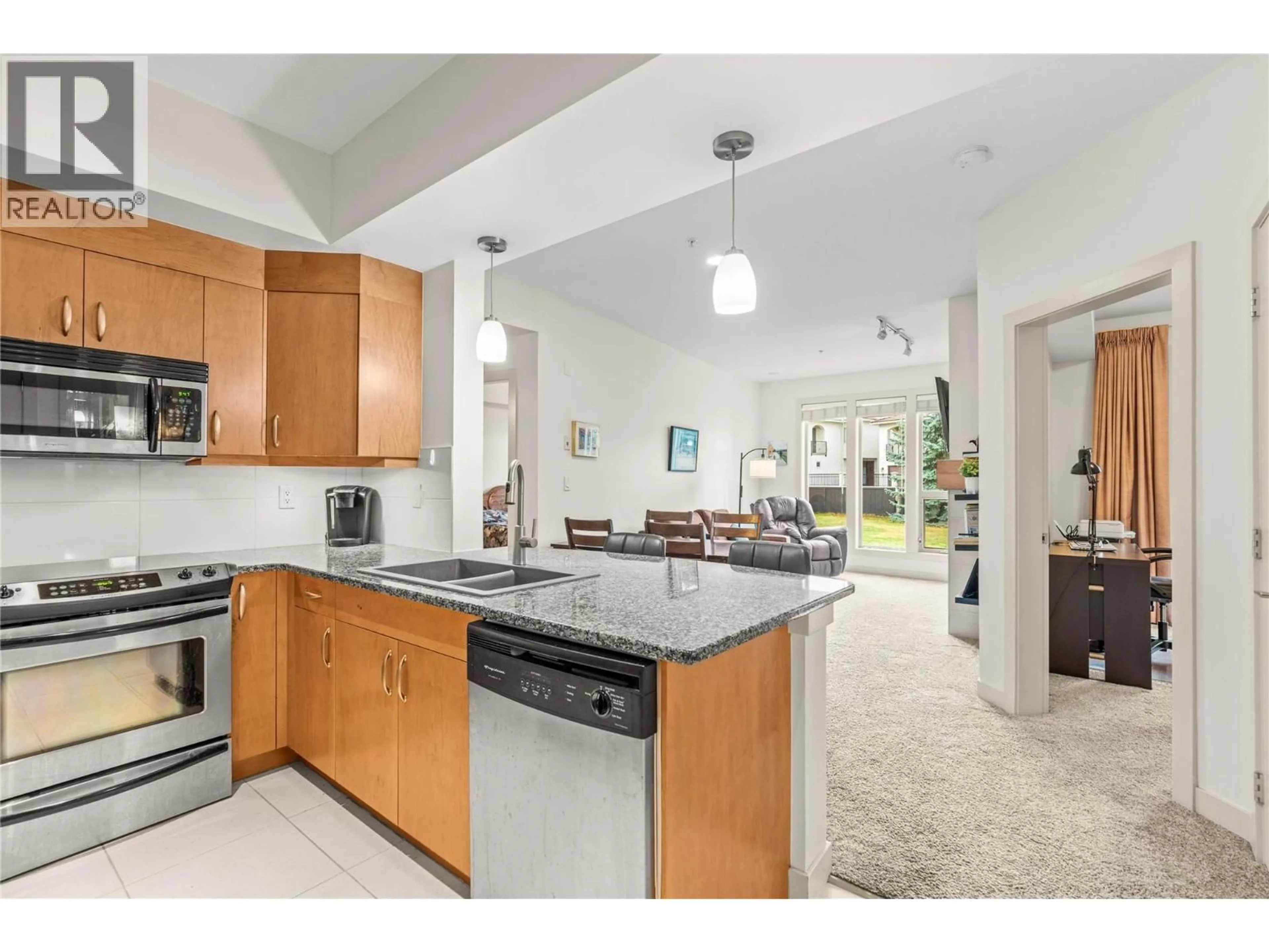 Open concept kitchen, ceramic/tile floor for 1112 - 7343 OKANAGAN LANDING ROAD, Vernon British Columbia V1H2J6
