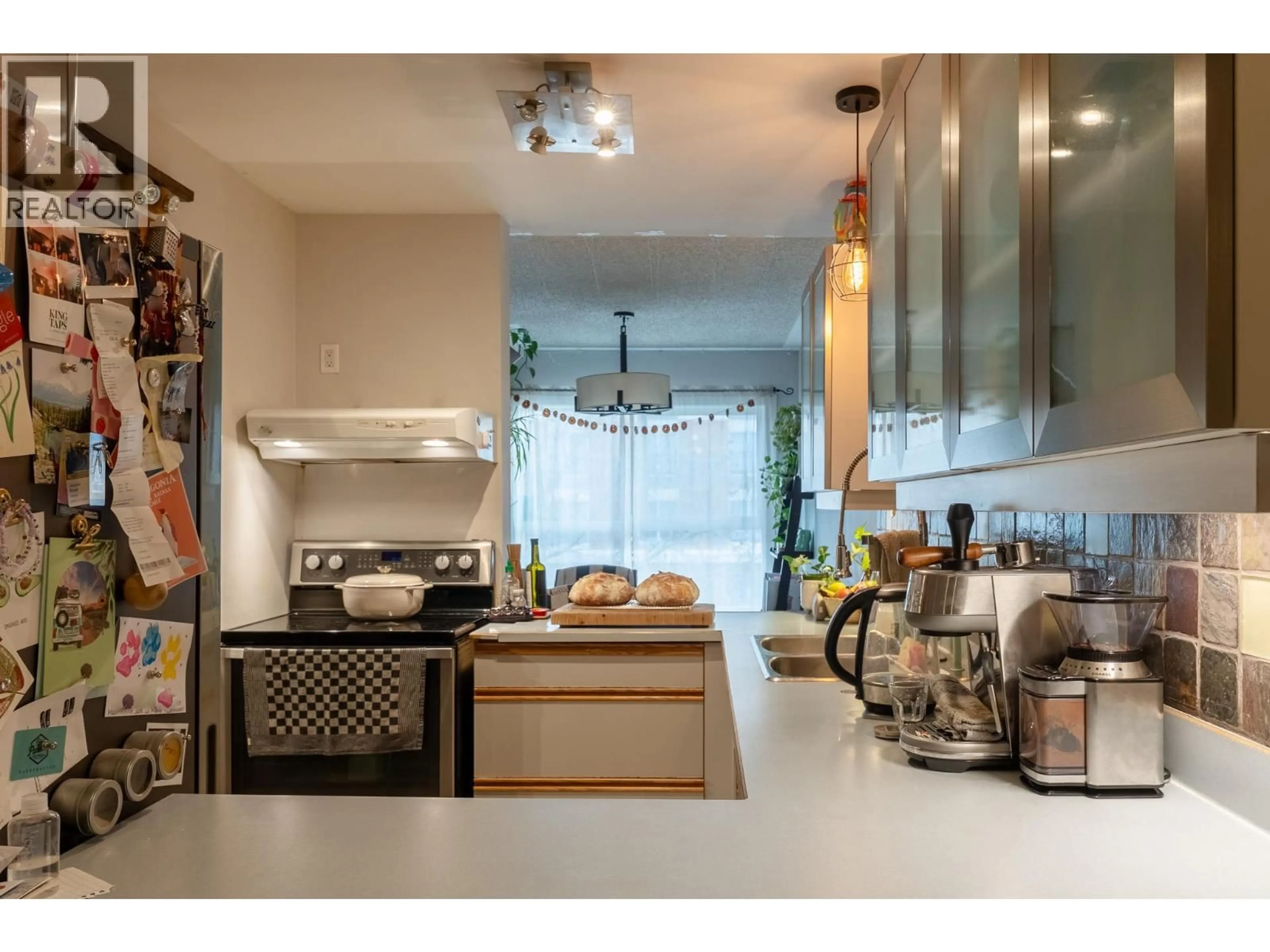 Open concept kitchen, ceramic/tile floor for 305 - 1685 UFTON COURT, Kelowna British Columbia V1Y8G7