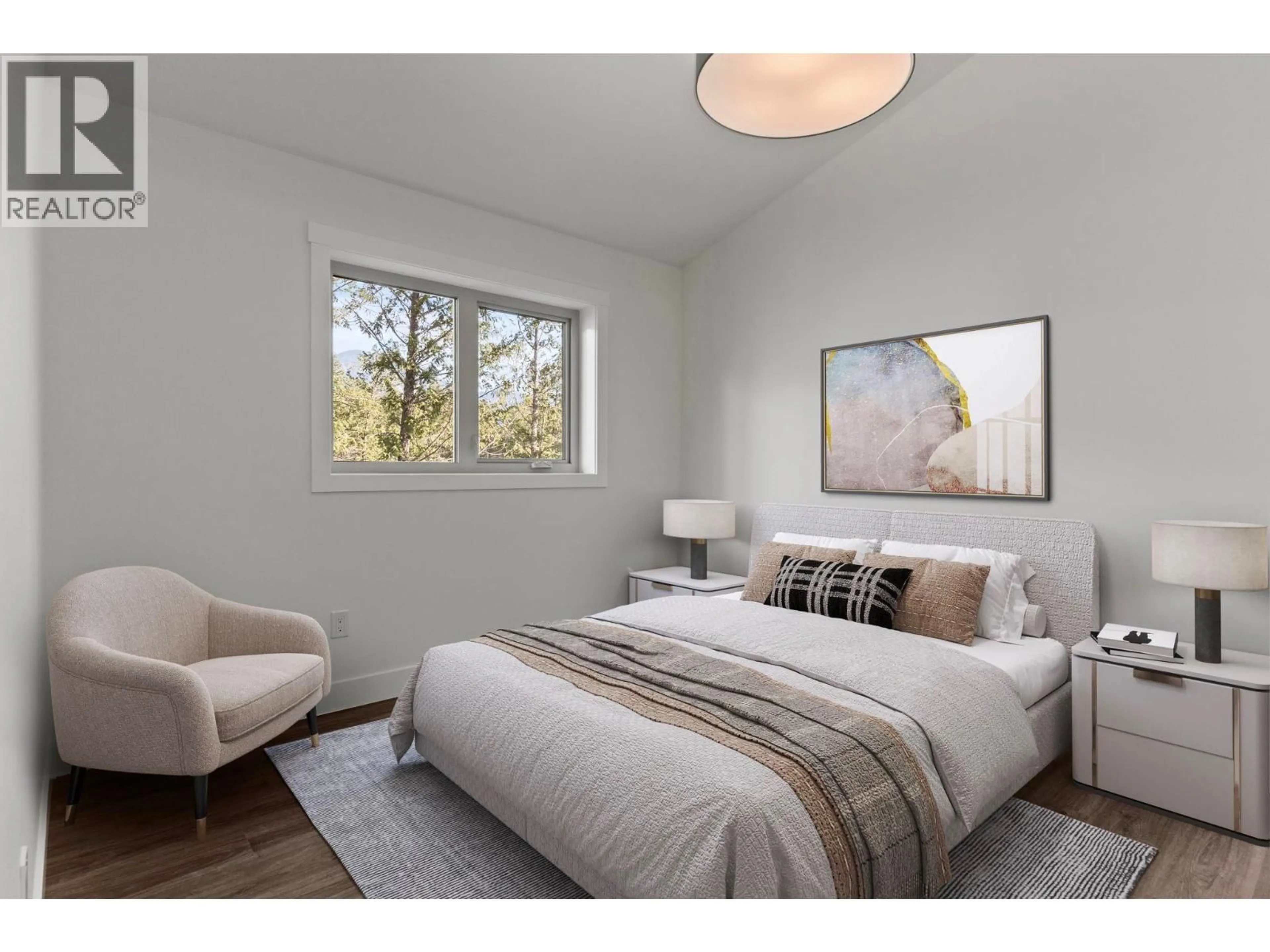 Bedroom with bed, wood/laminate floor for 53 - 4926 TIMBER RIDGE ROAD, Windermere British Columbia V0B1L0