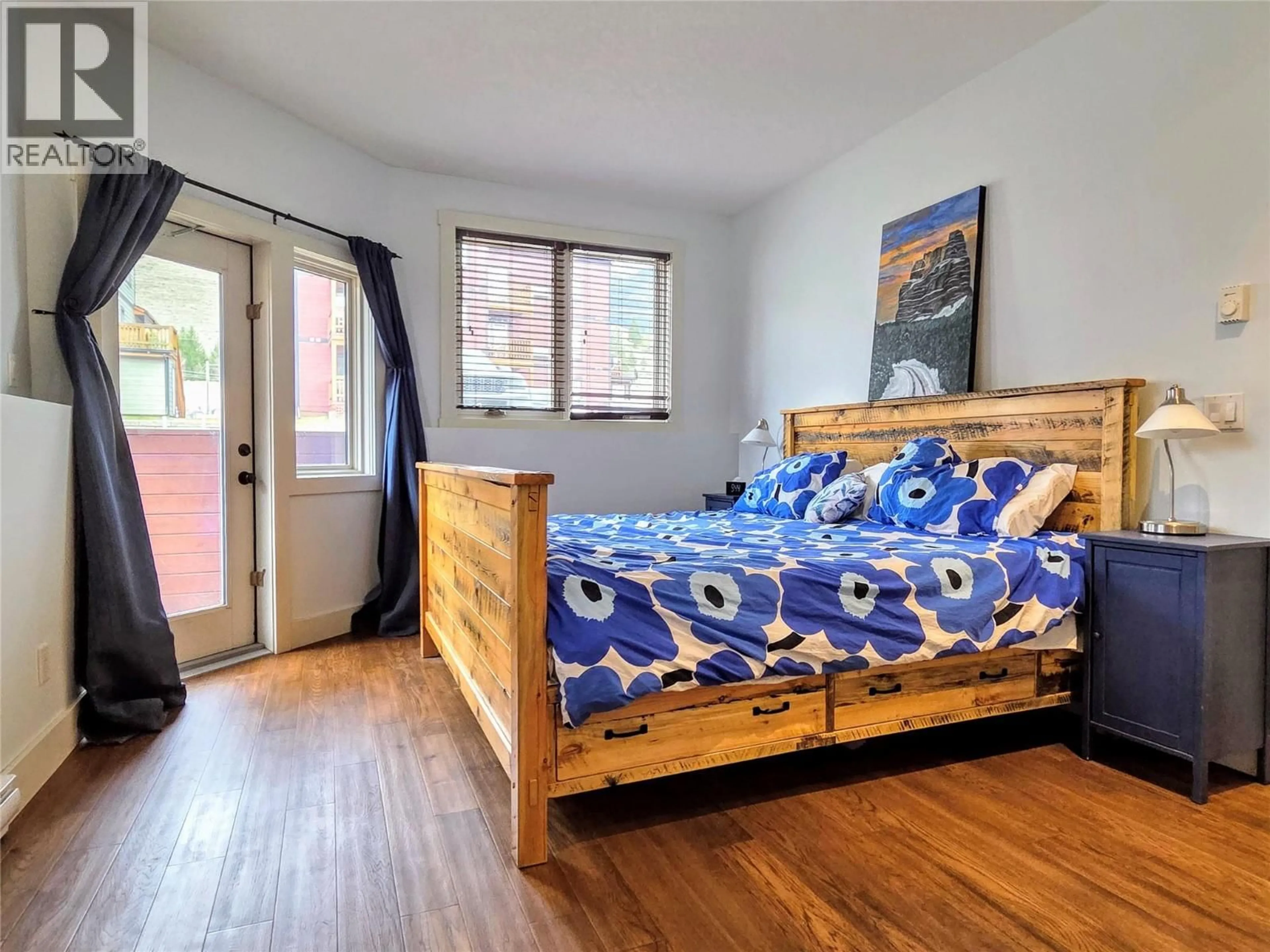 Bedroom with bed, wood/laminate floor for 502 - 7337 PROSPECTOR AVENUE, Radium Hot Springs British Columbia V0A1M0