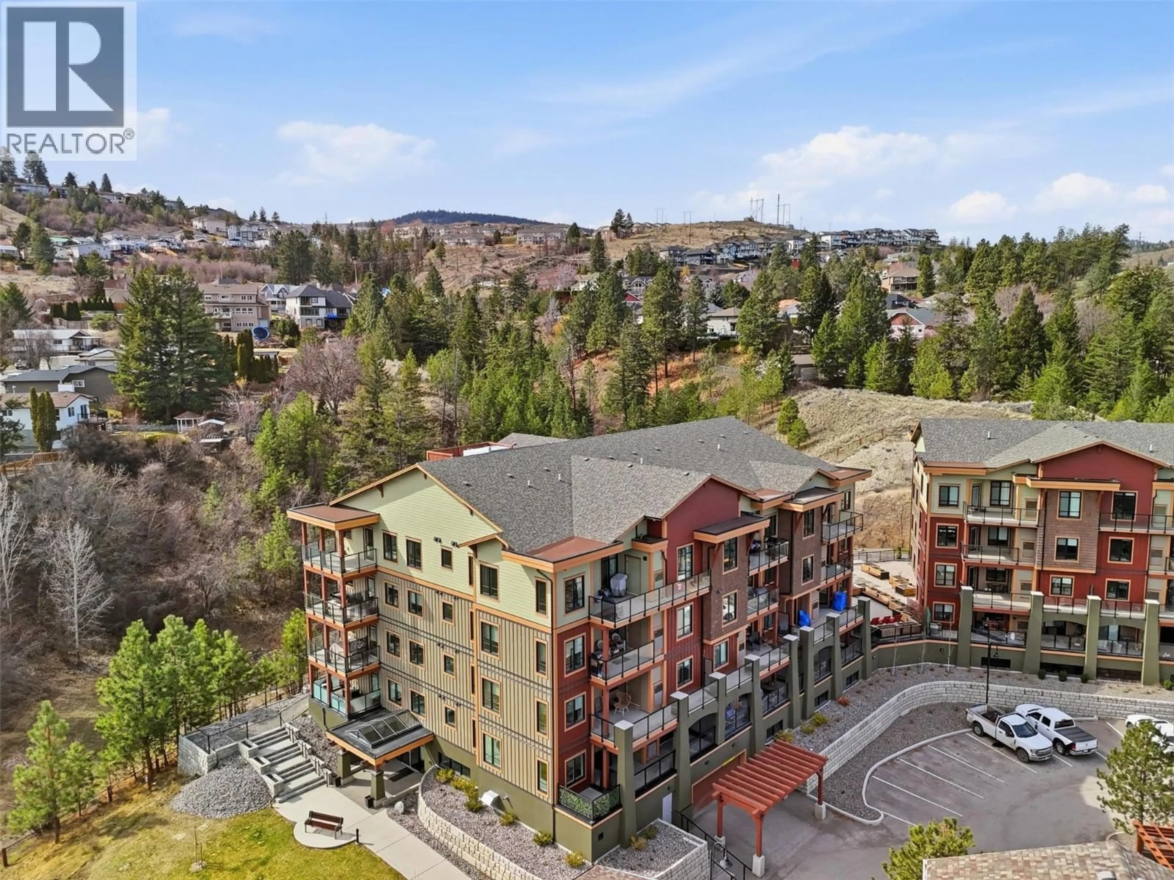 A pic from outside/outdoor area/front of a property/back of a property/a pic from drone, mountain view for 2103 - 1405 SPRINGHILL DRIVE, Kamloops British Columbia V2C0B4