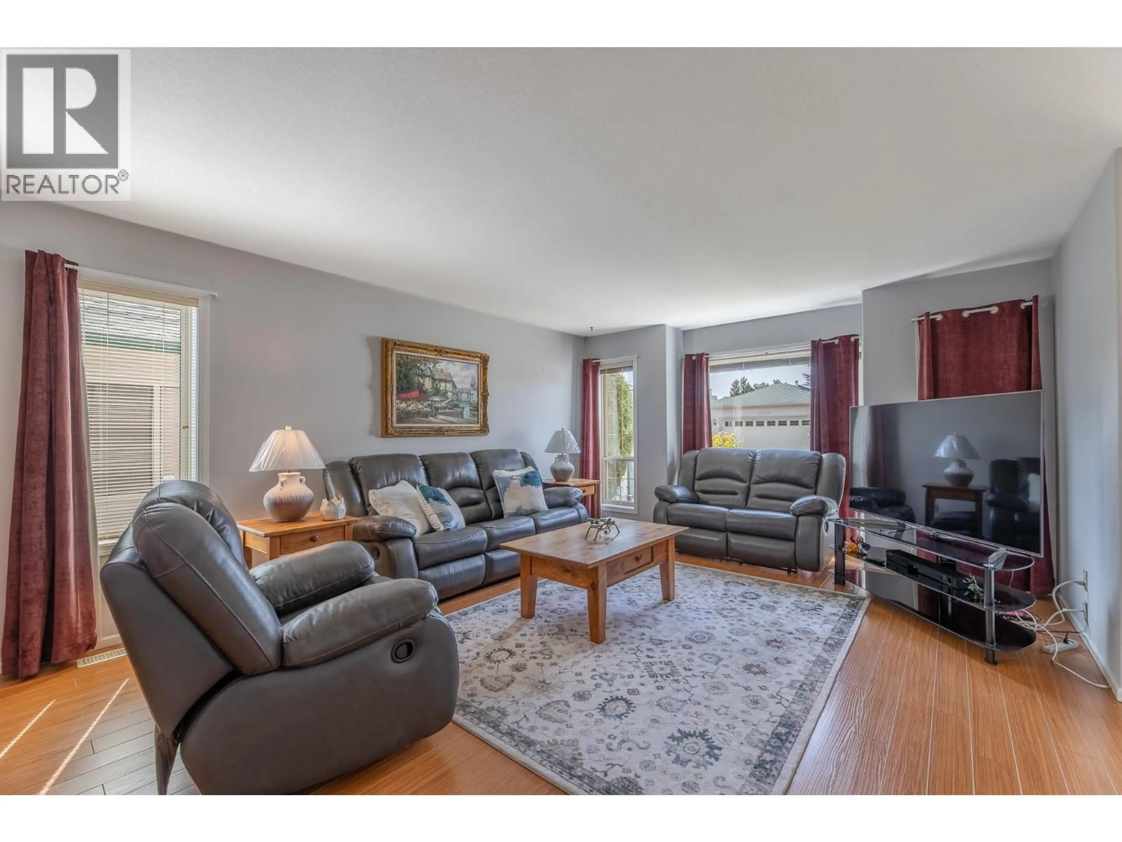 Living room with furniture, wood/laminate floor for 450 - 2330 BUTT ROAD, West Kelowna British Columbia V4T2L3