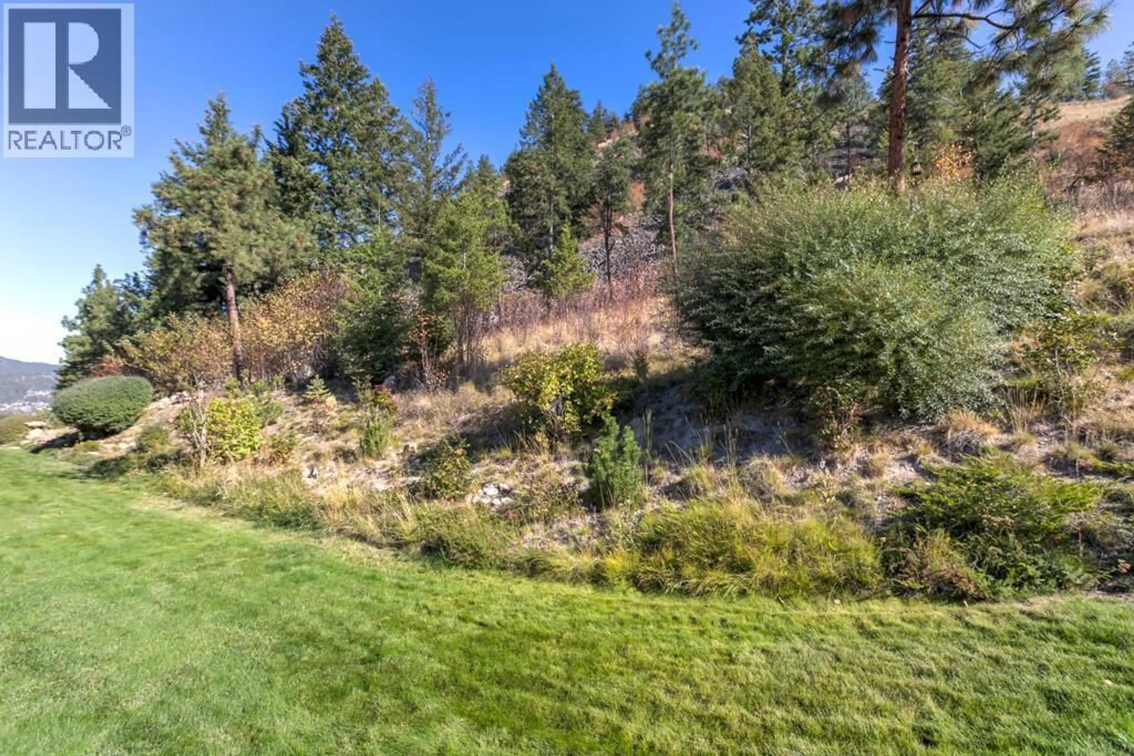A pic from outside/outdoor area/front of a property/back of a property/a pic from drone, forest/trees view for 358 - 663 DENALI COURT, Kelowna British Columbia V1V2R4
