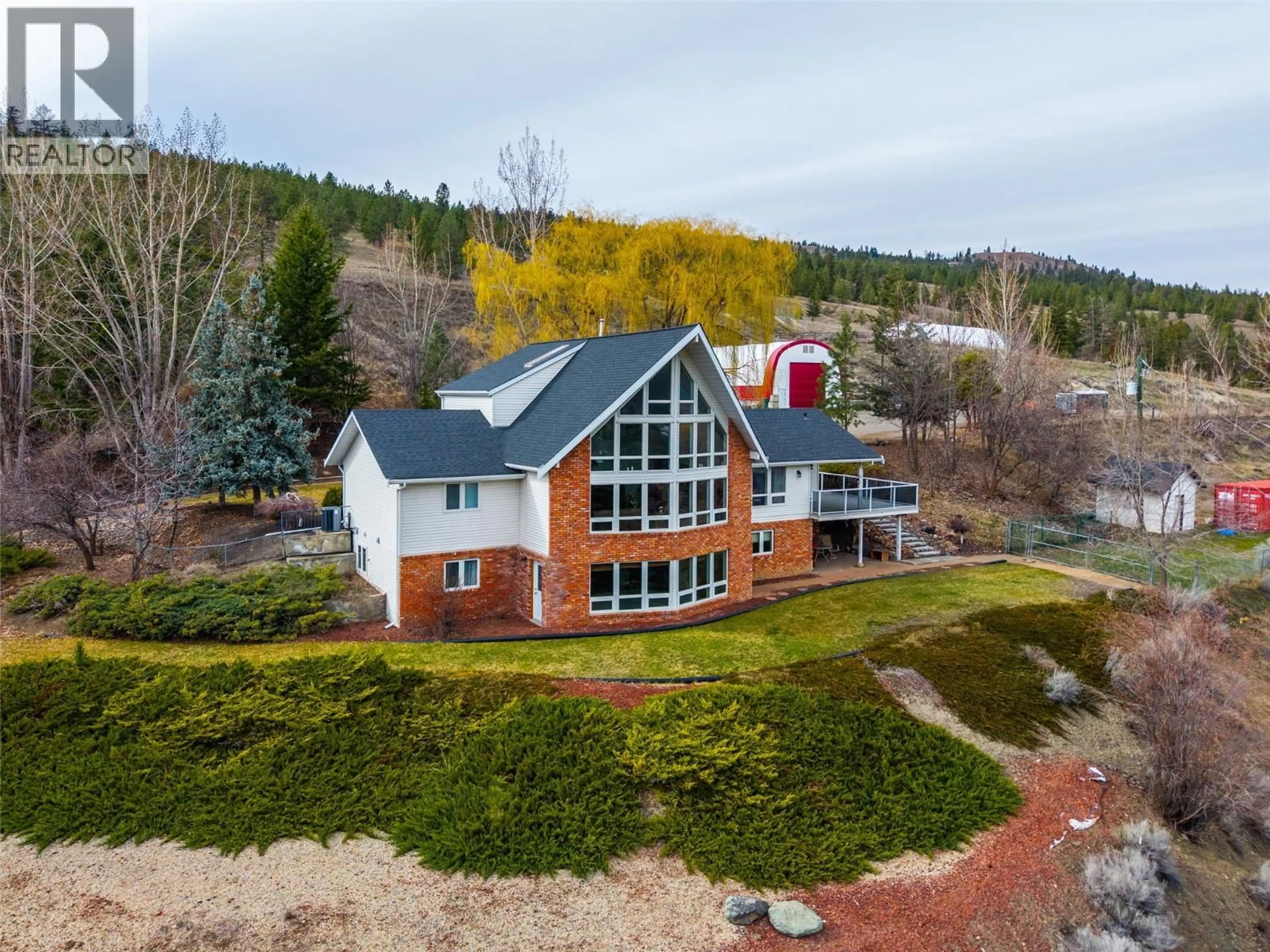 A pic from outside/outdoor area/front of a property/back of a property/a pic from drone, mountain view for 4702 WESTSYDE ROAD, Kamloops British Columbia V2B8N4