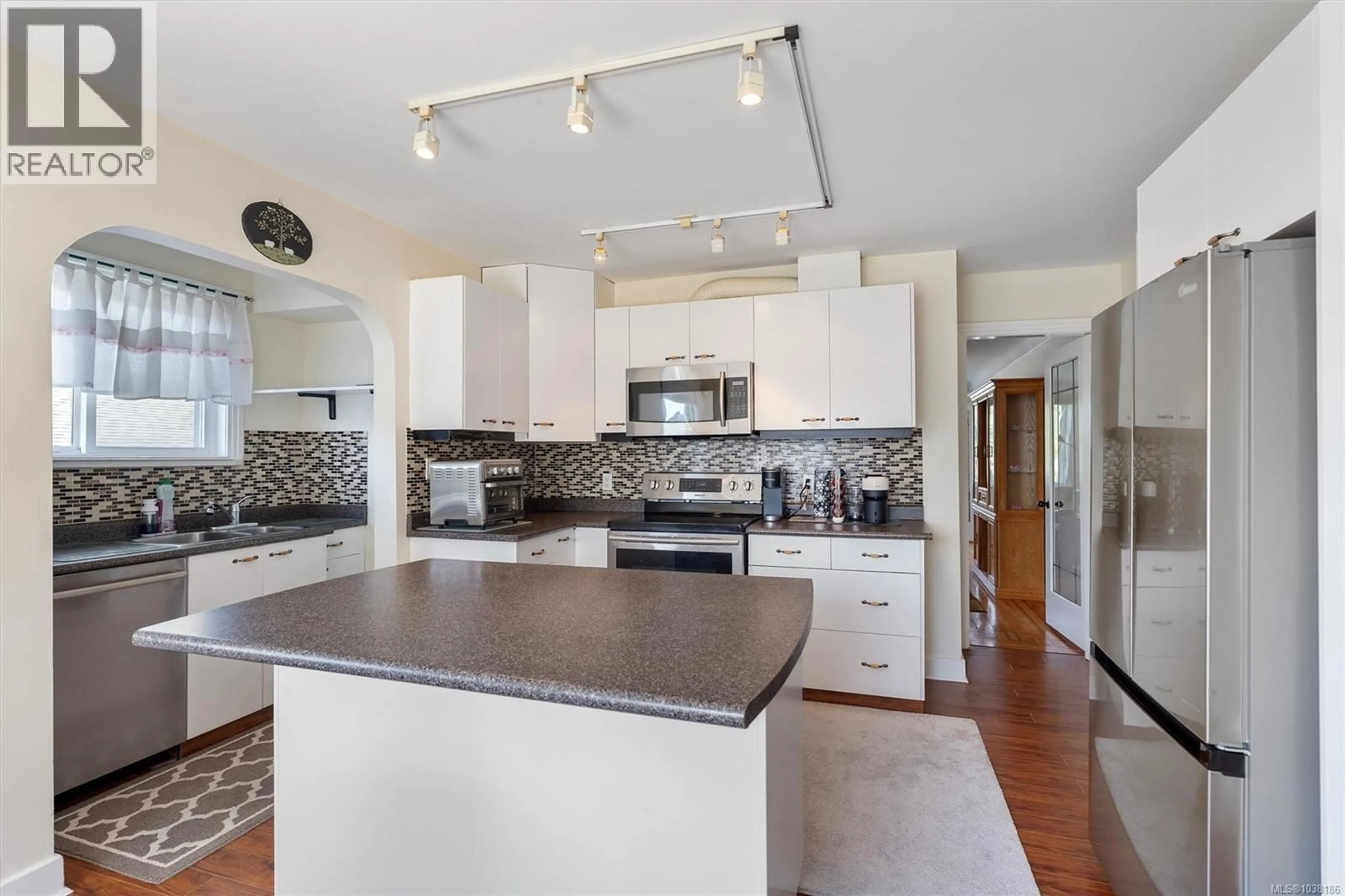 Open concept kitchen, ceramic/tile floor for 3161 DONALD STREET, Saanich British Columbia V8V3P7