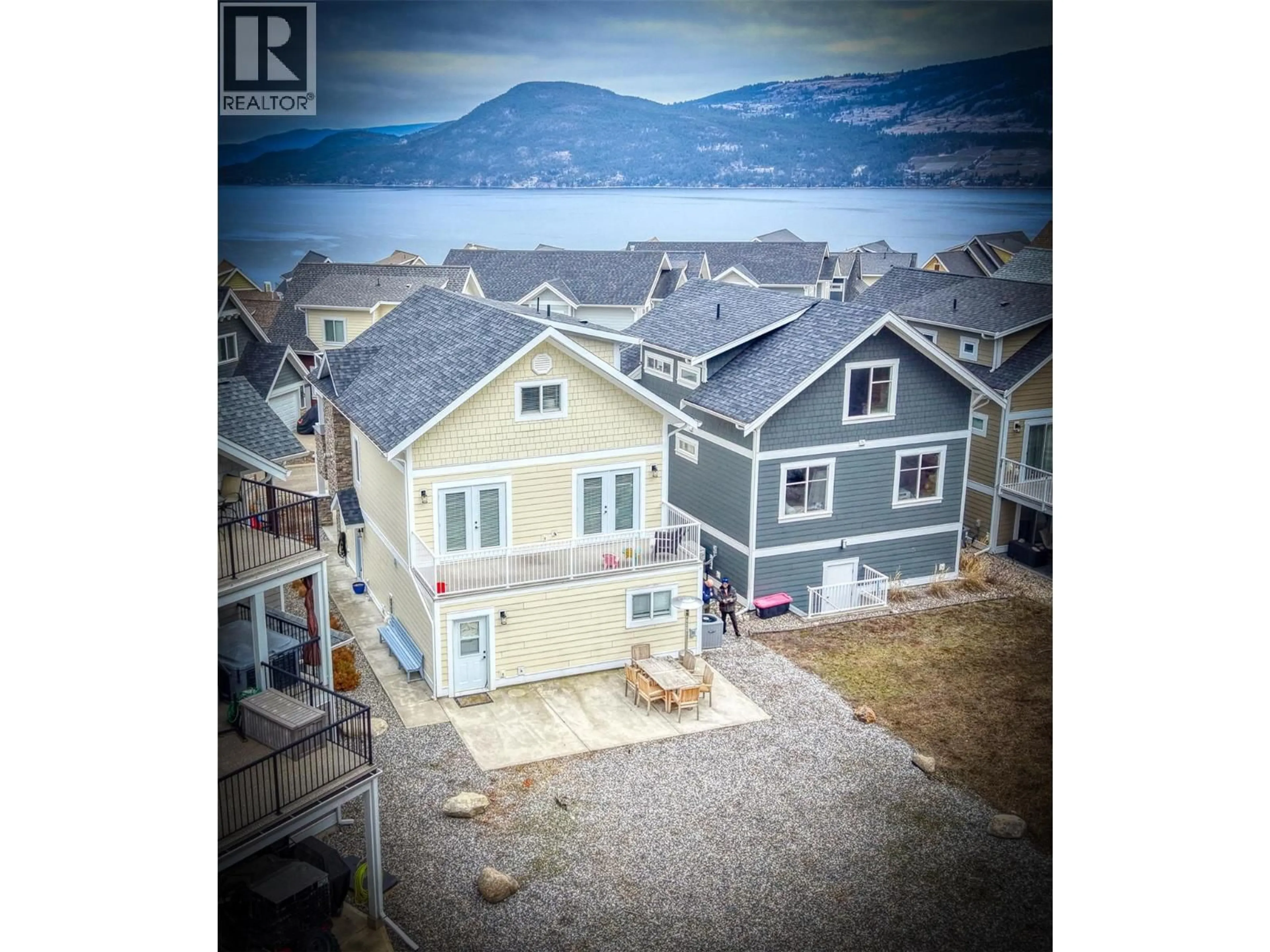 A pic from outside/outdoor area/front of a property/back of a property/a pic from drone, water/lake/river/ocean view for 304 - 6746 MARBELLA LOOP, Kelowna British Columbia V1Z3R8