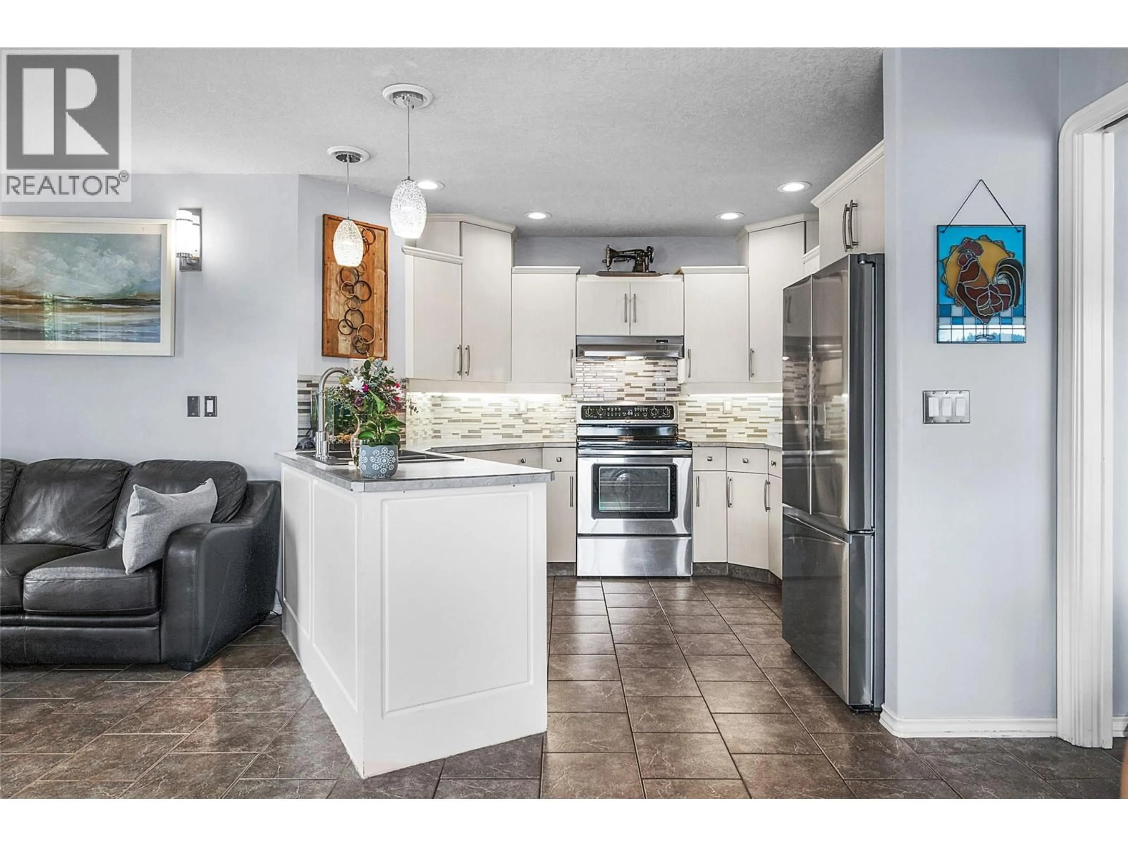 Open concept kitchen, ceramic/tile floor for 7095 AMBER DRIVE, Vernon British Columbia V1H1P4