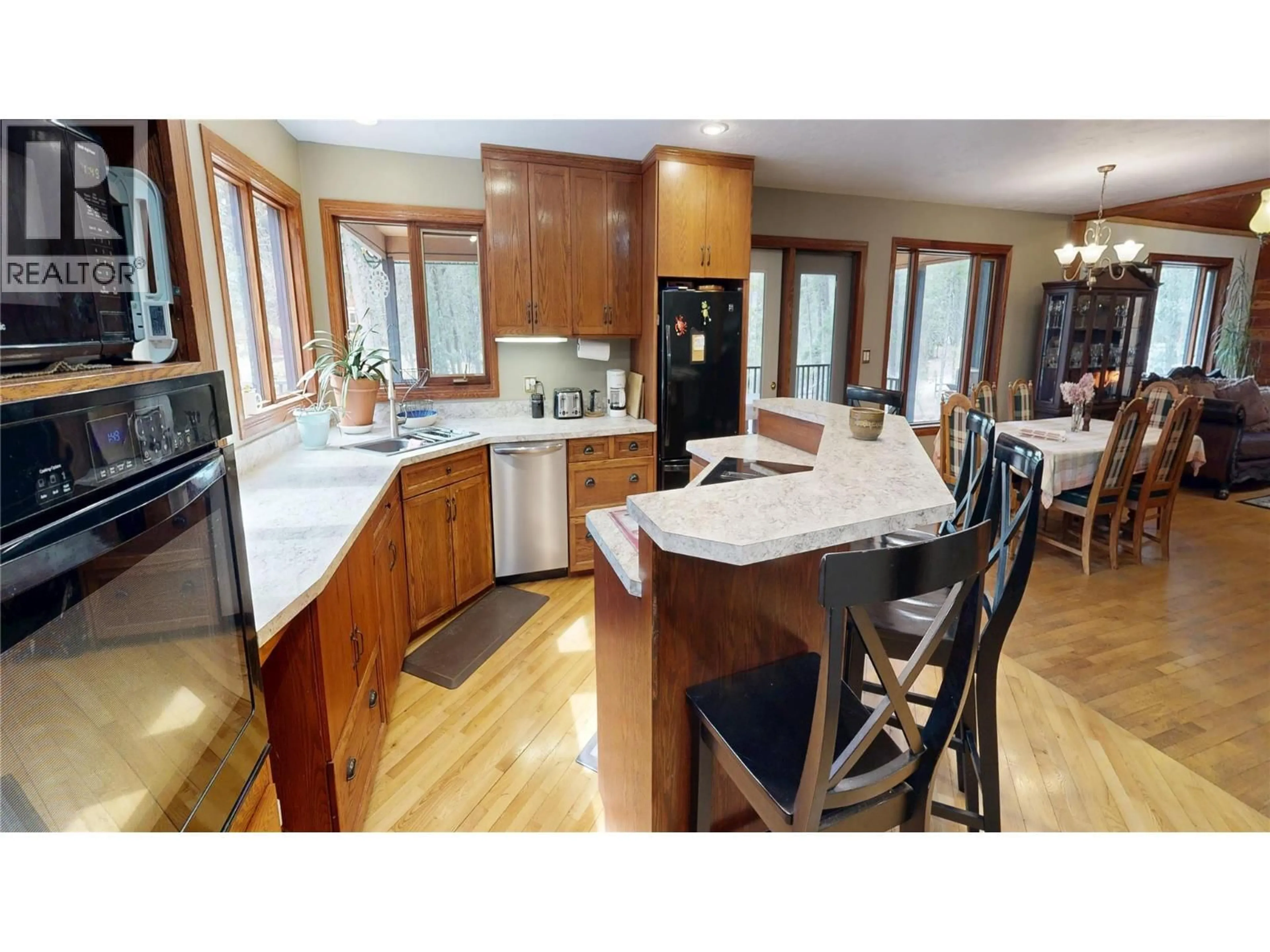 Open concept kitchen, wood/laminate floor for 4406 ASHTON ROAD, Spur Valley British Columbia V0A1B0