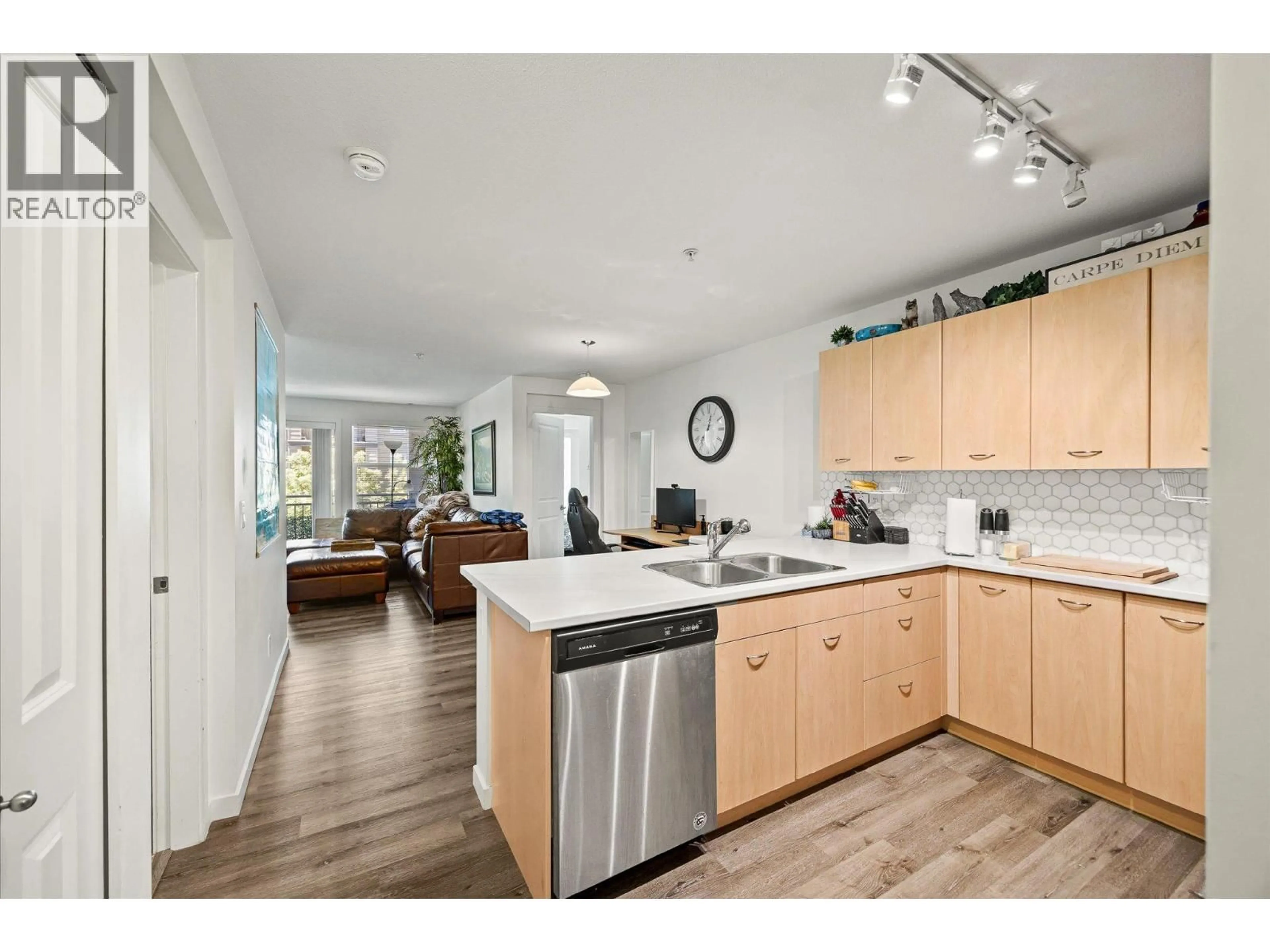 Open concept kitchen, wood/laminate floor for 215 - 539 YATES ROAD, Kelowna British Columbia V1V2T8