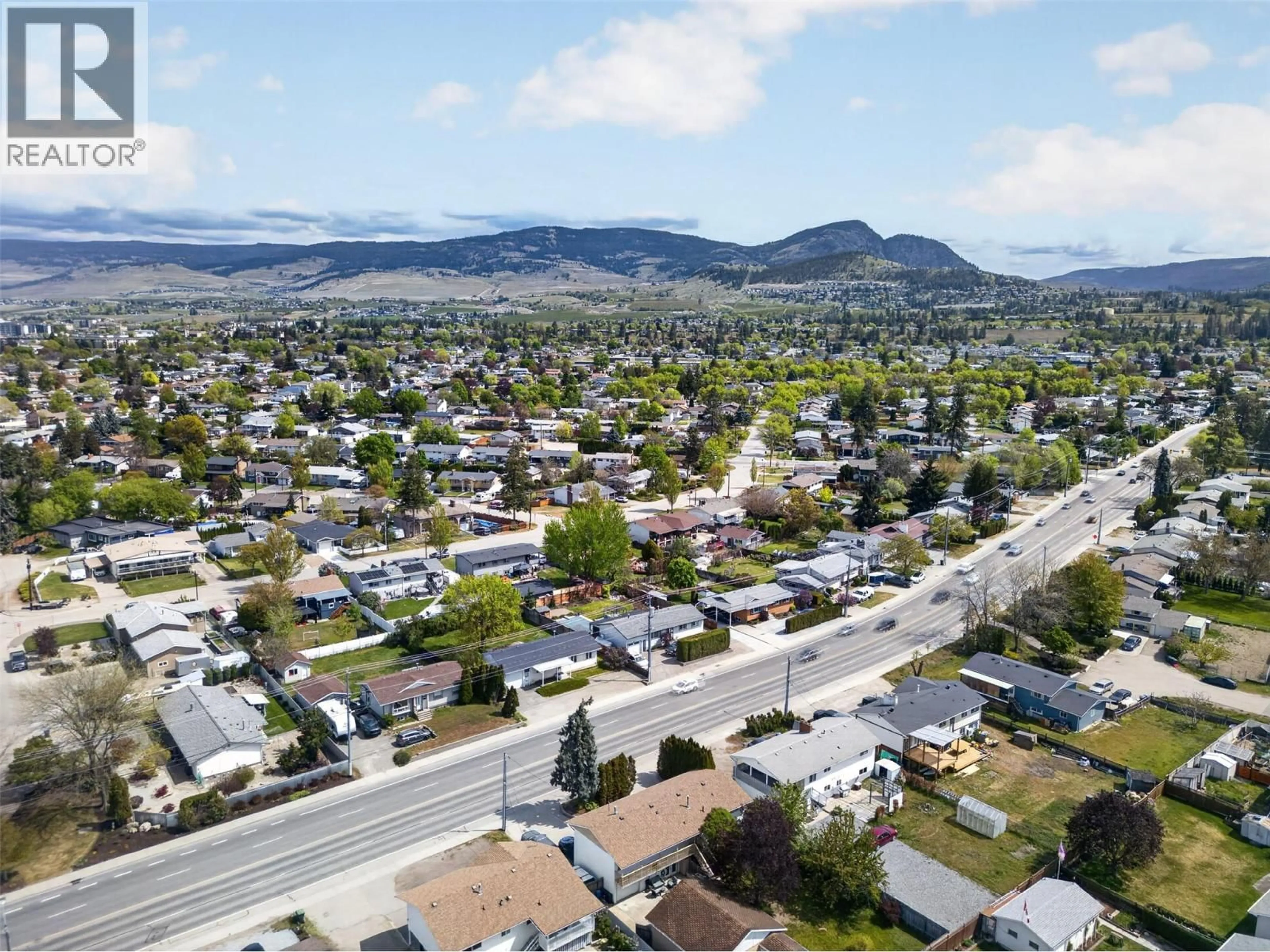 A pic from outside/outdoor area/front of a property/back of a property/a pic from drone, mountain view for 2647 SPRINGFIELD ROAD, Kelowna British Columbia V1X1B9