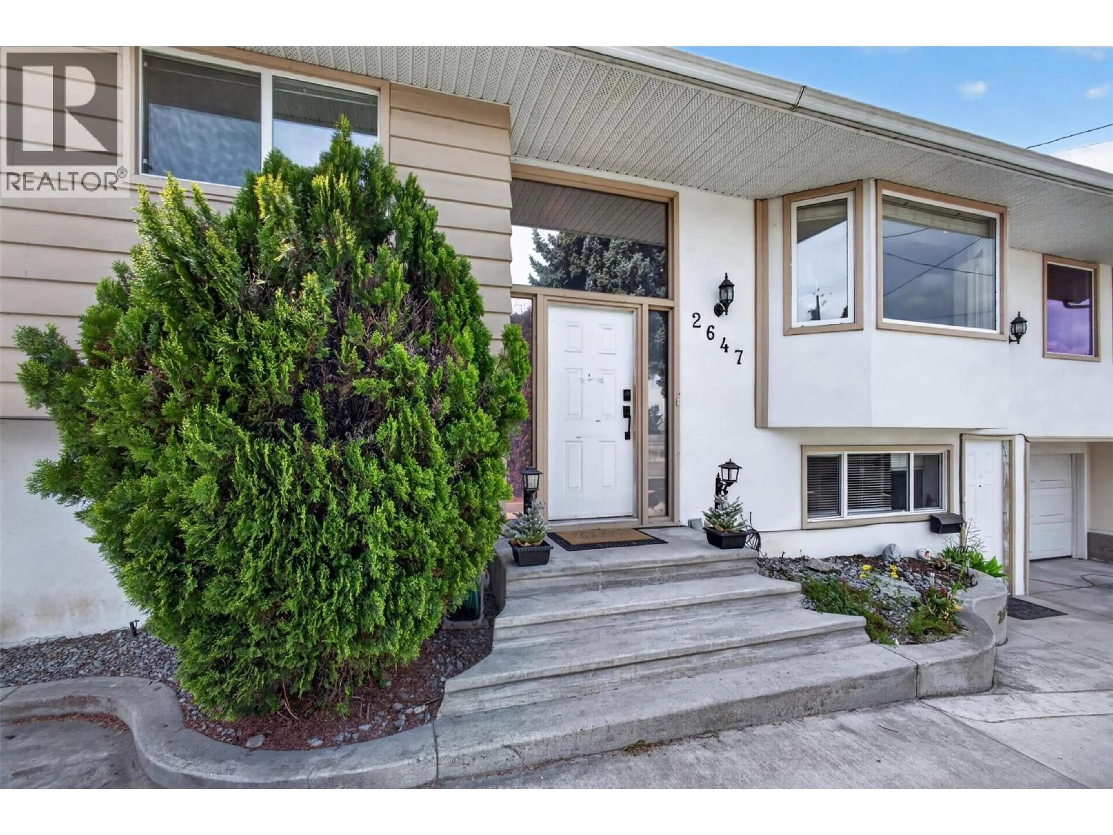 Home with vinyl exterior material, street for 2647 SPRINGFIELD ROAD, Kelowna British Columbia V1X1B9