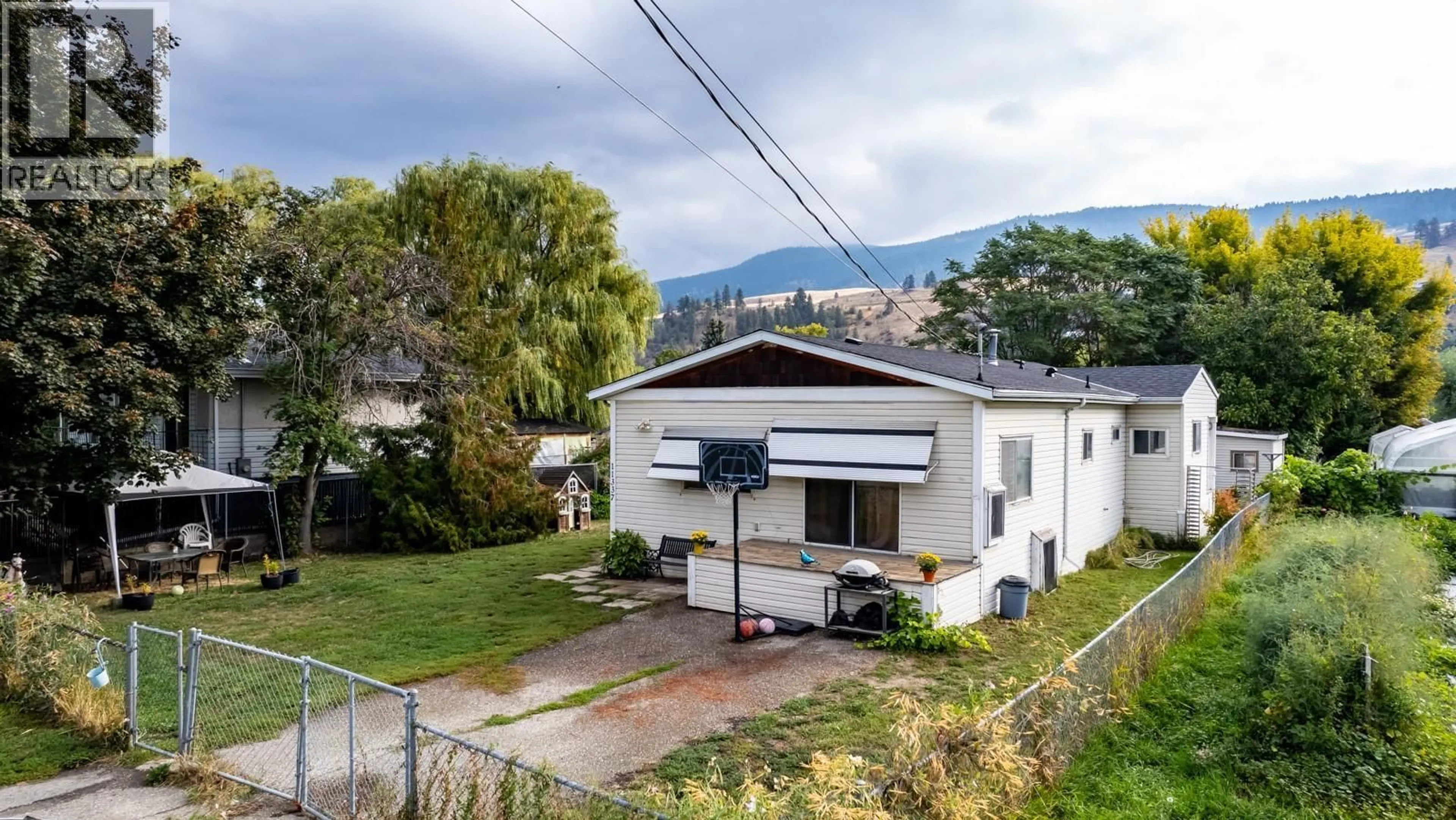 A pic from outside/outdoor area/front of a property/back of a property/a pic from drone, mountain view for 11337 REISWIG ROAD, Lake Country British Columbia V4V1X5