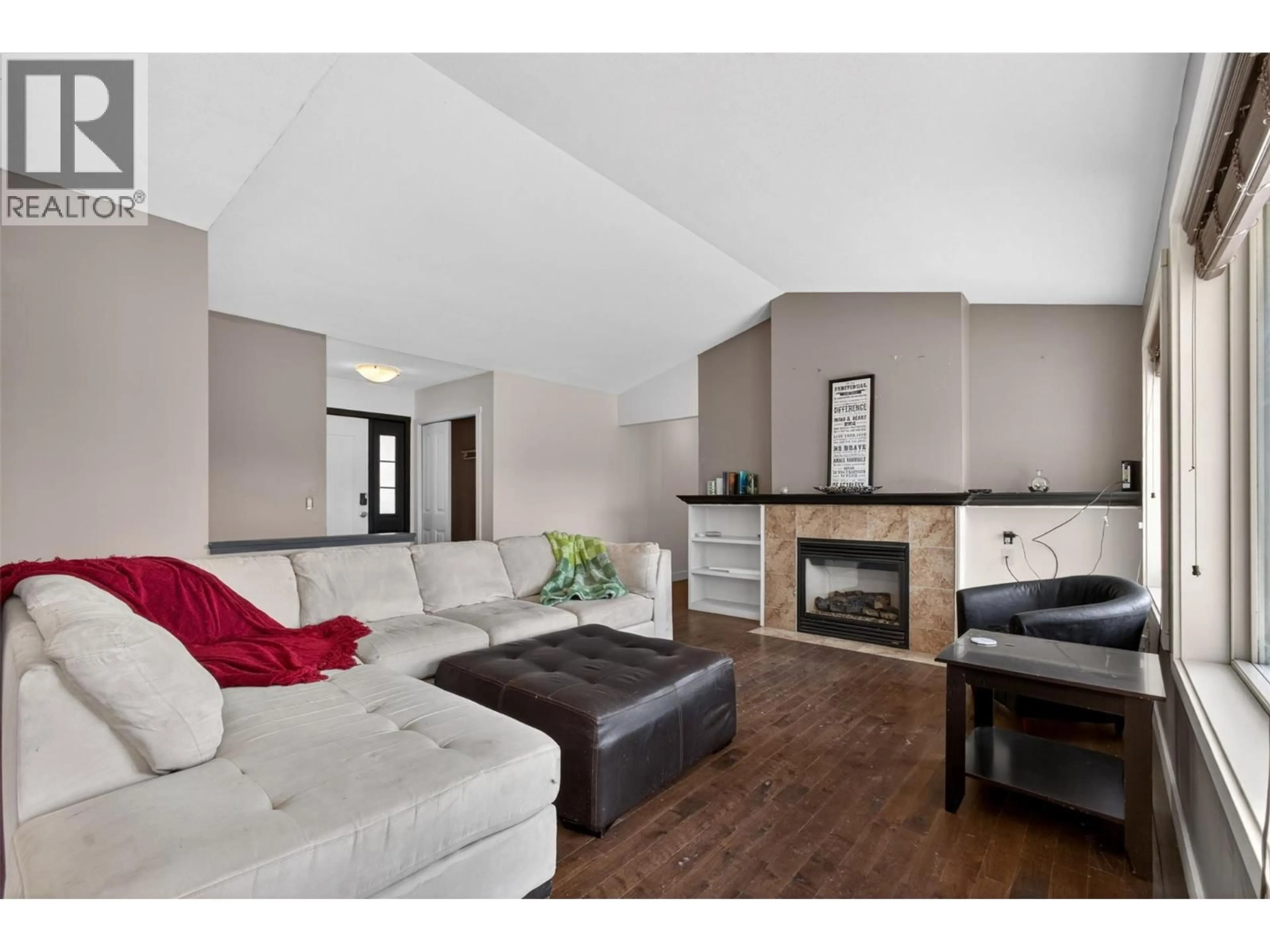 Living room with furniture, wood/laminate floor for 10346 COPPER HILL PLACE, Lake Country British Columbia V4V2P3