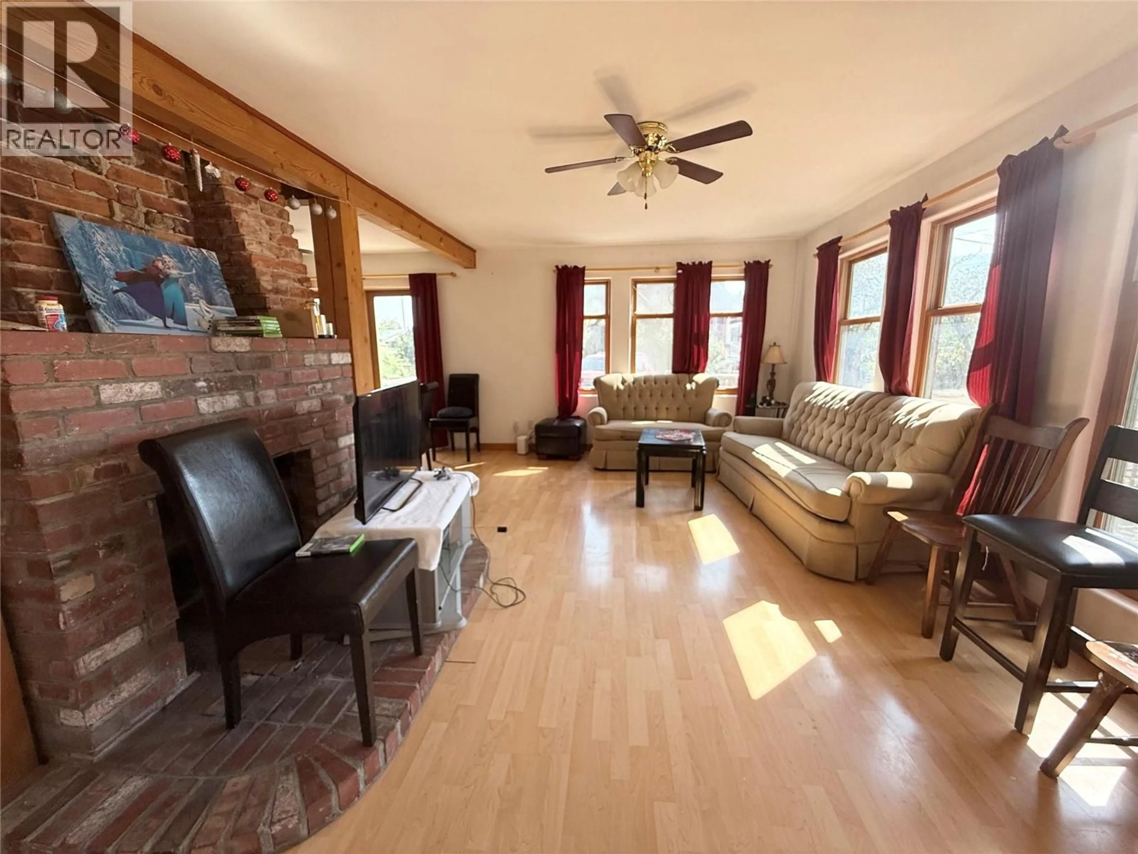 Living room with furniture, wood/laminate floor for 1325 QUILCHENA AVENUE, Merritt British Columbia V1K1B8