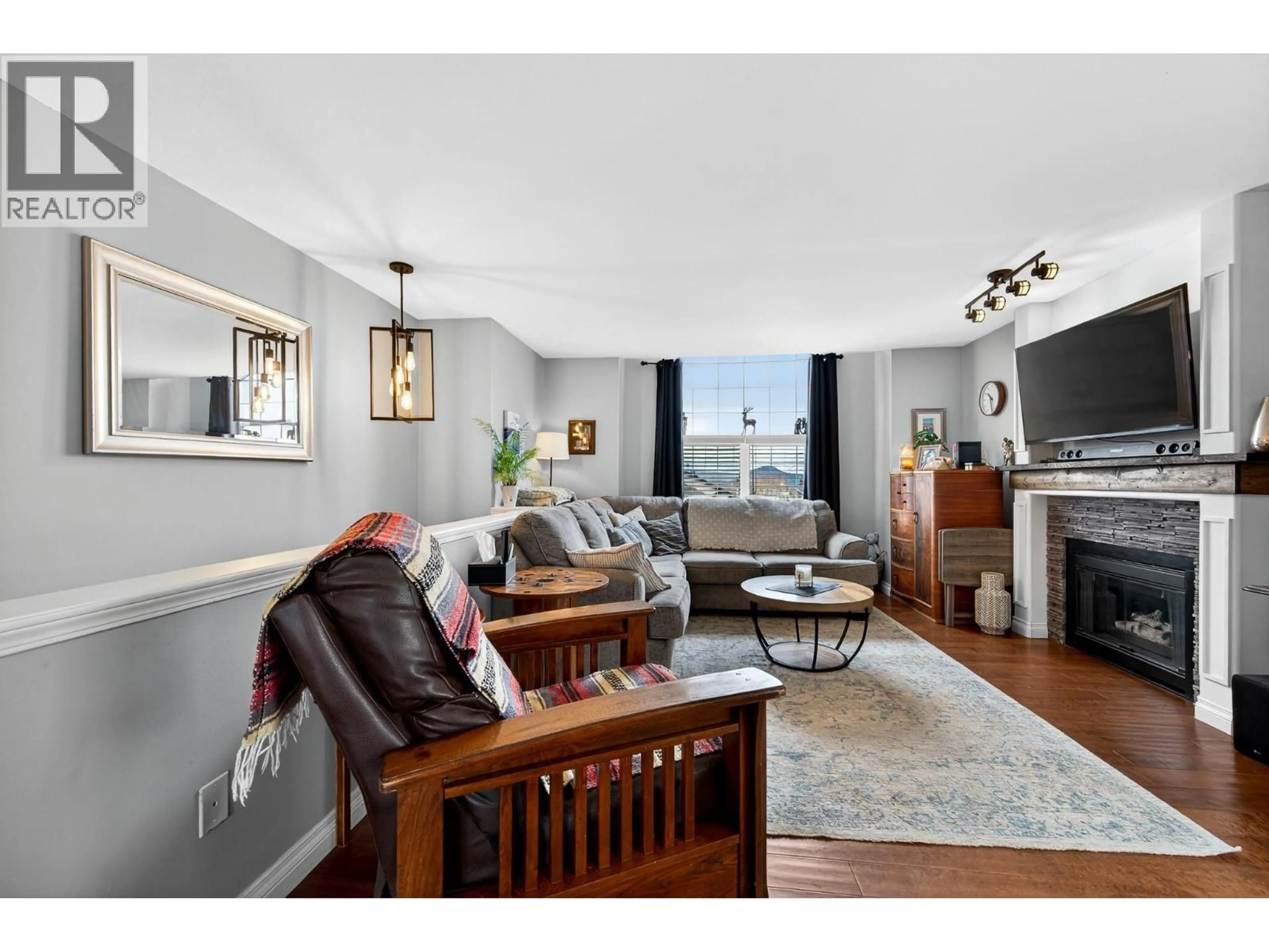 Living room with furniture, wood/laminate floor for 2348 WHITBURN CRESCENT, Kamloops British Columbia V1S1W4