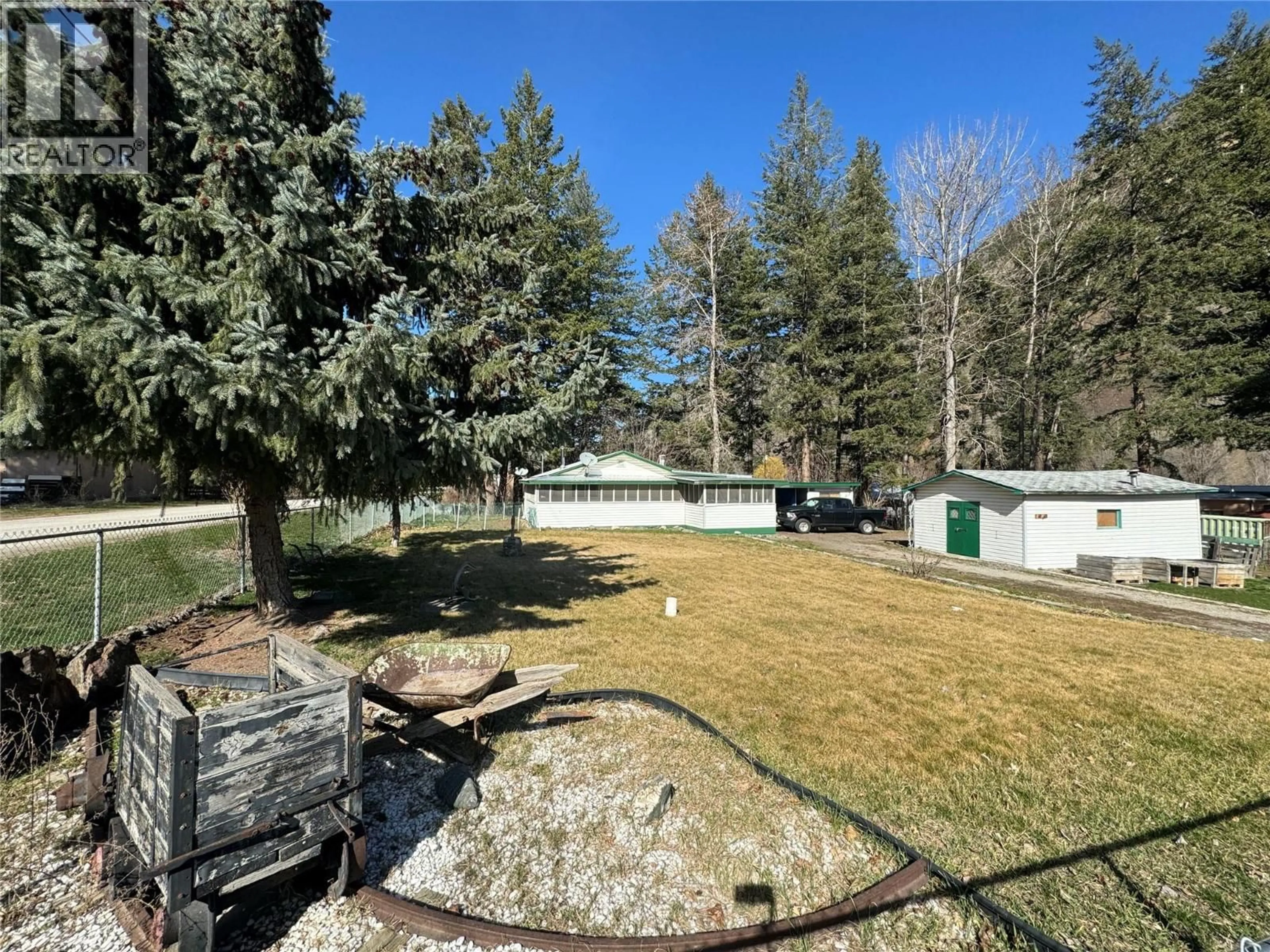 A pic from outside/outdoor area/front of a property/back of a property/a pic from drone, forest/trees view for 1483 MAIN STREET, Olalla British Columbia V0X1N6
