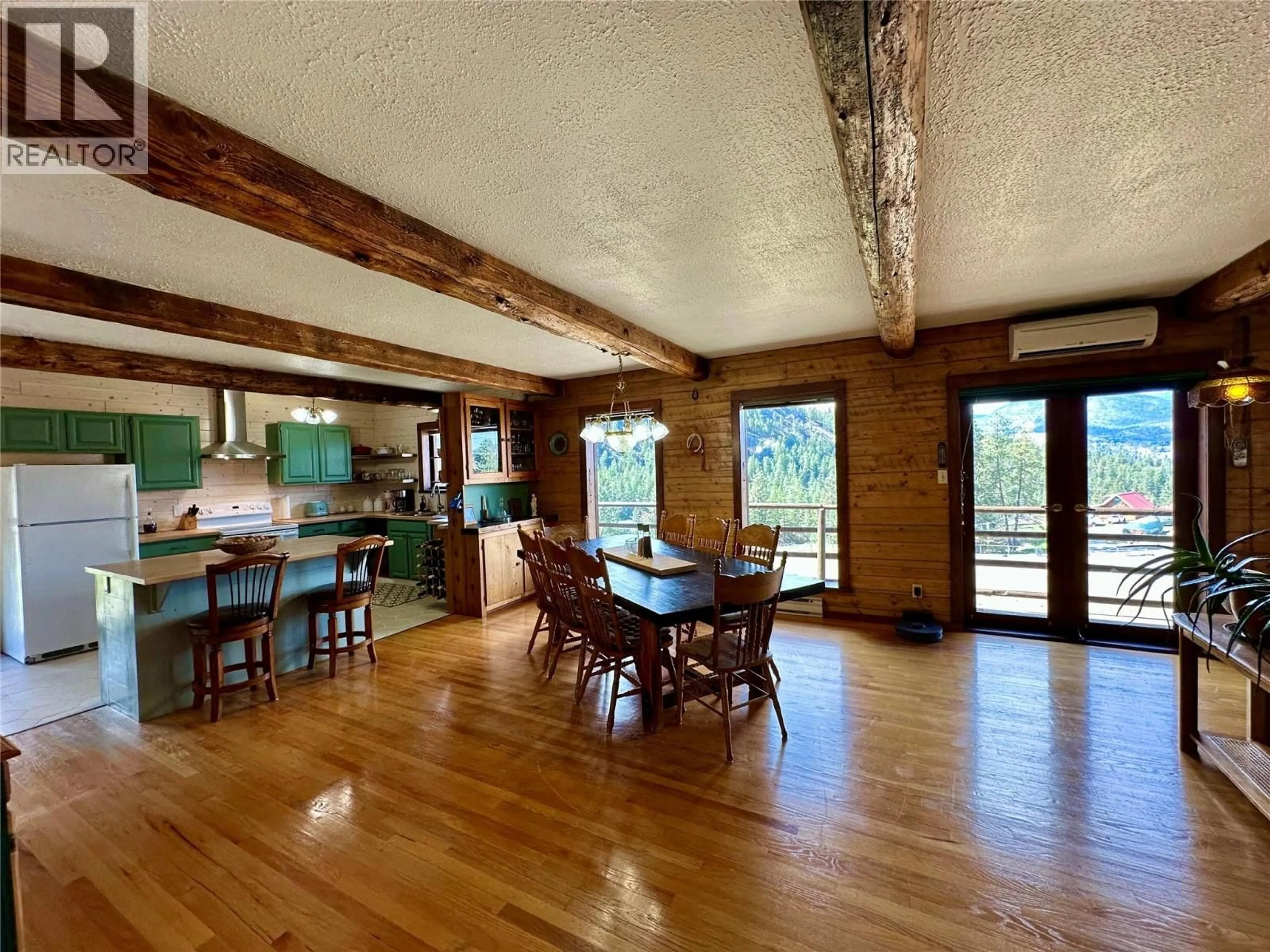 Dining room, wood/laminate floor for 3655 MCLEAN CREEK ROAD, Okanagan Falls British Columbia V0H1R5