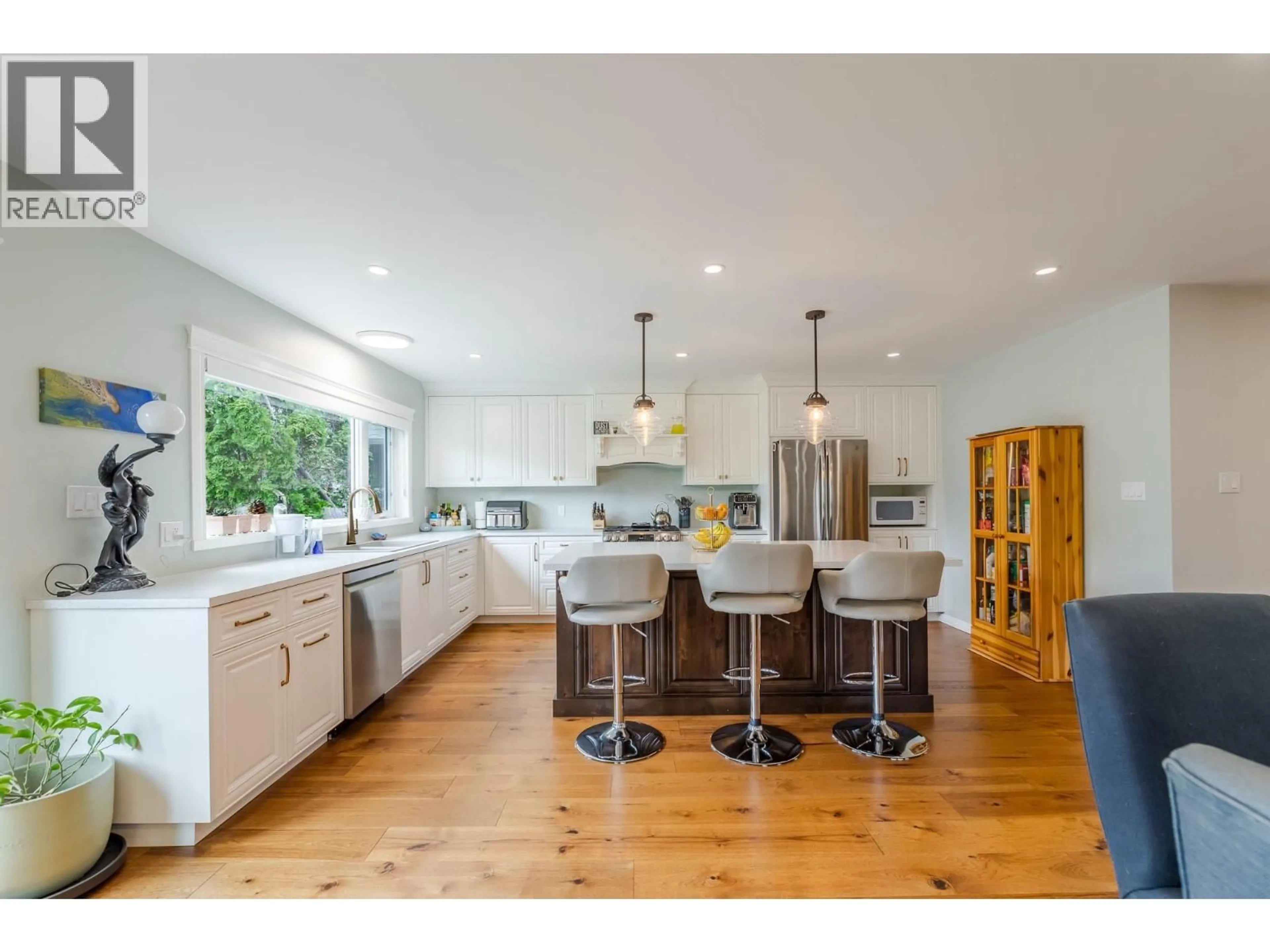 Open concept kitchen, wood/laminate floor for 10903 BARCLAY STREET, Summerland British Columbia V0H1Z0