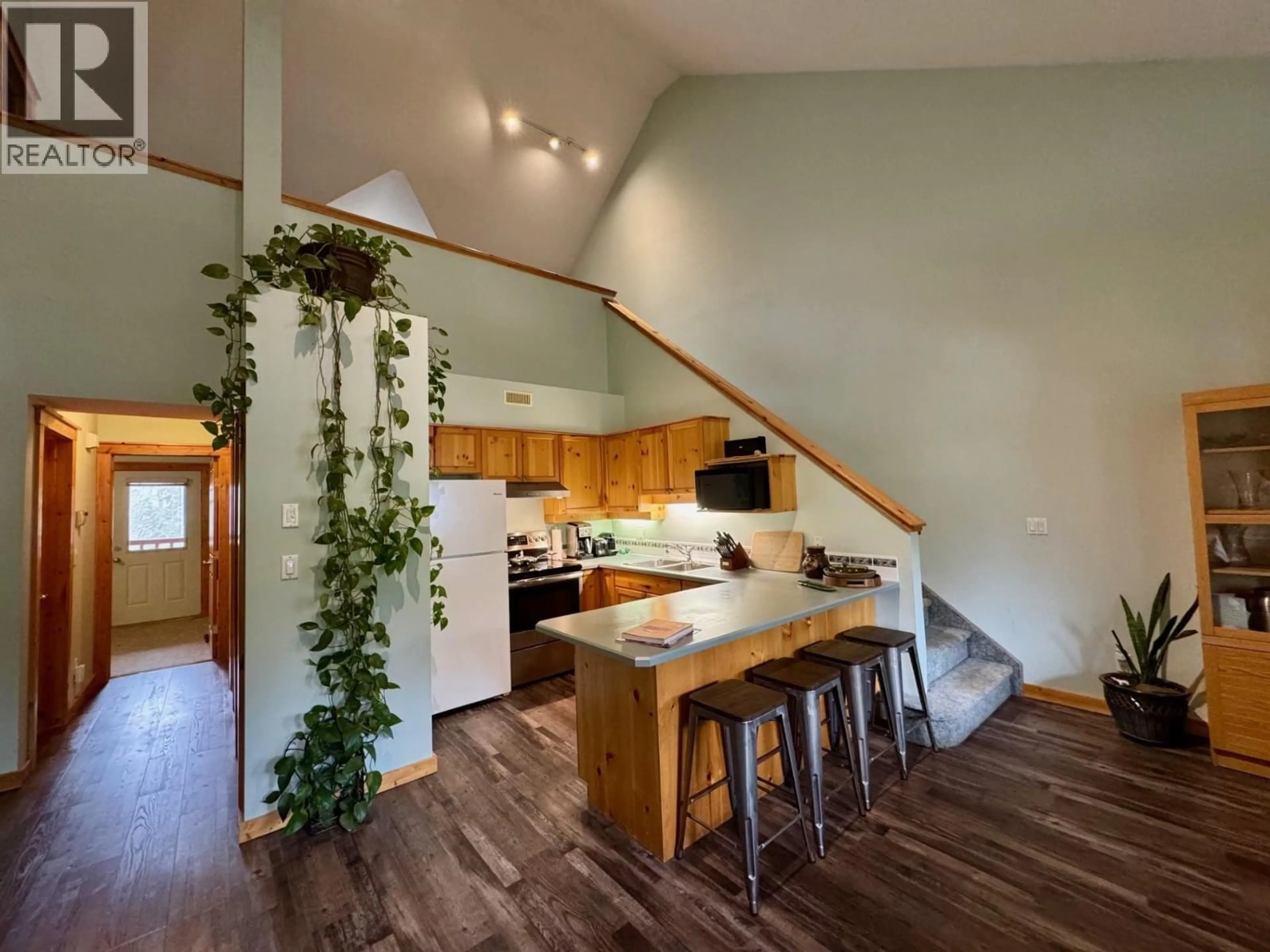 Open concept kitchen, wood/laminate floor for 2 - 300 CANYON TRAIL, Fernie British Columbia V0B1M5