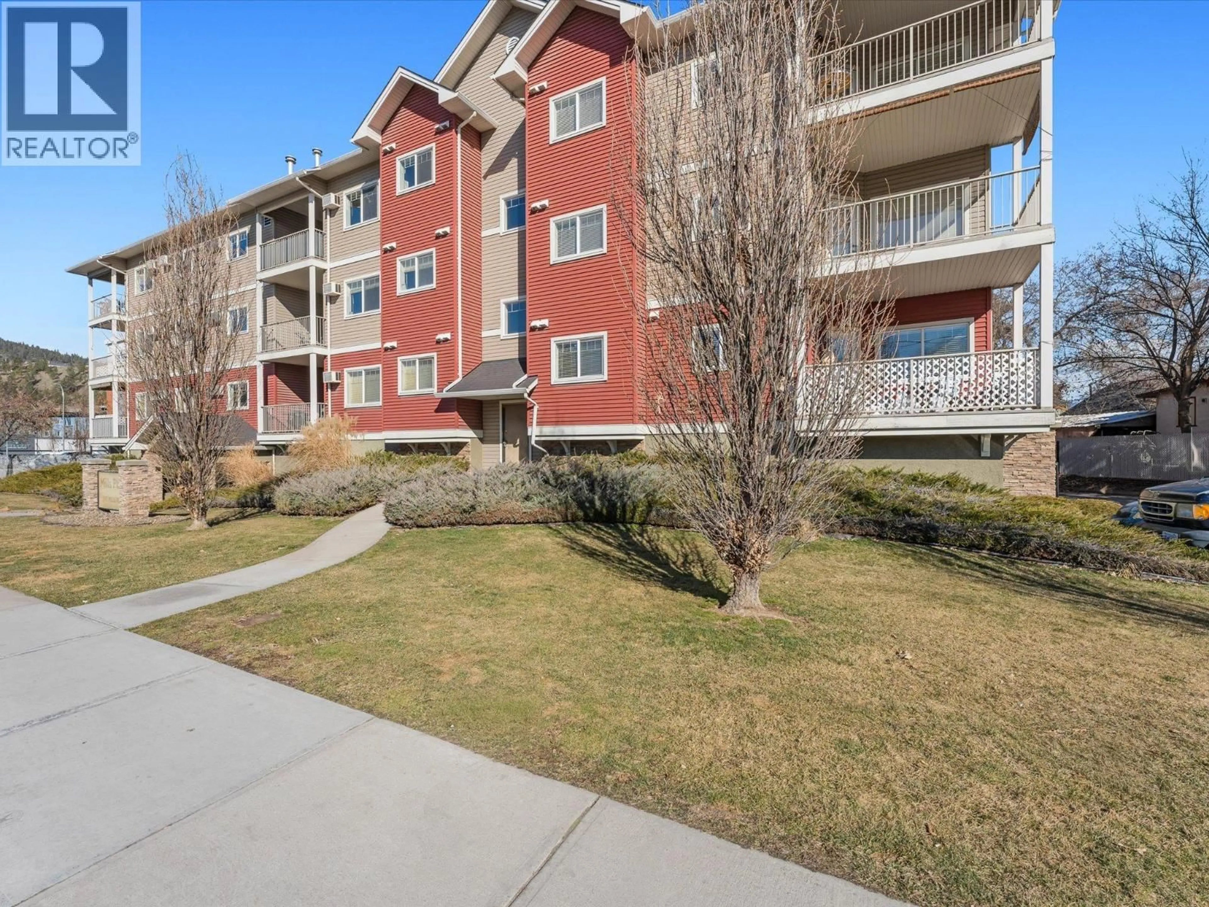 A pic from outside/outdoor area/front of a property/back of a property/a pic from drone, unknown for 302 - 345 MILLS ROAD, Kelowna British Columbia V1X4G9