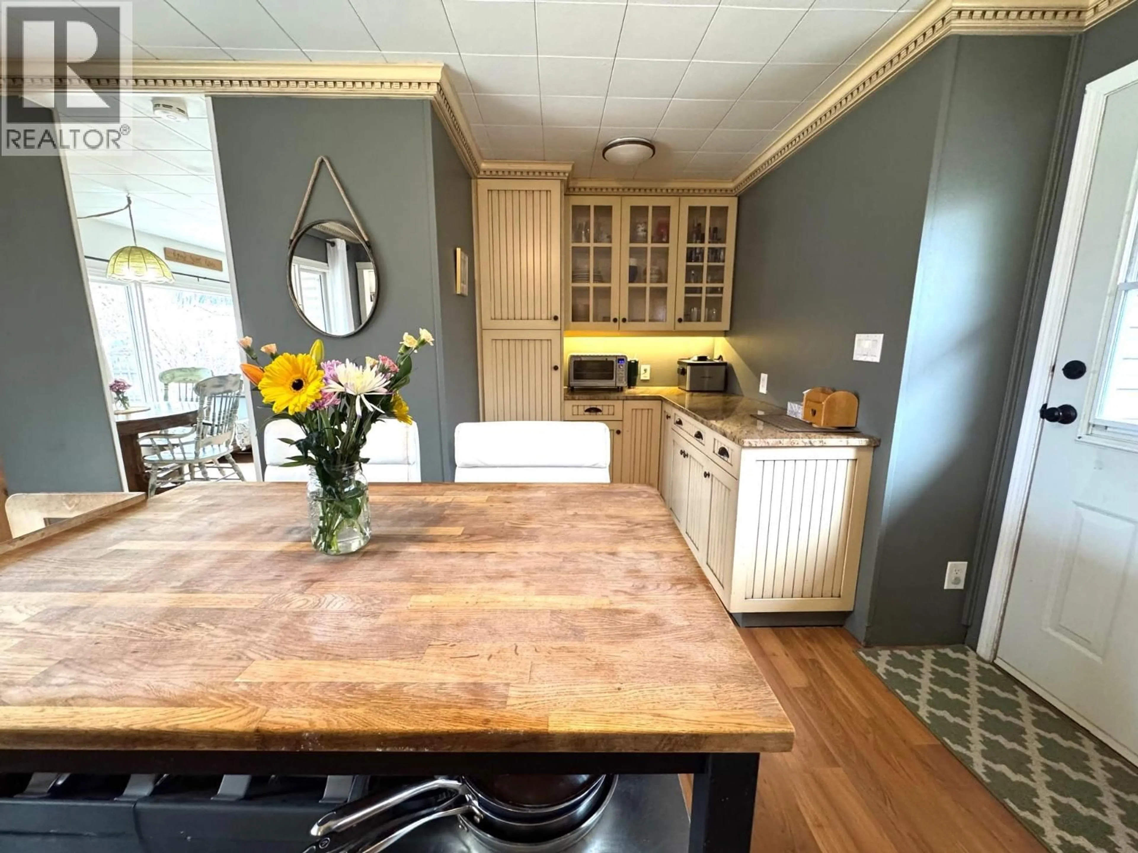 Open concept kitchen, wood/laminate floor for 1963 GRANITE AVENUE, Merritt British Columbia V1K1B8