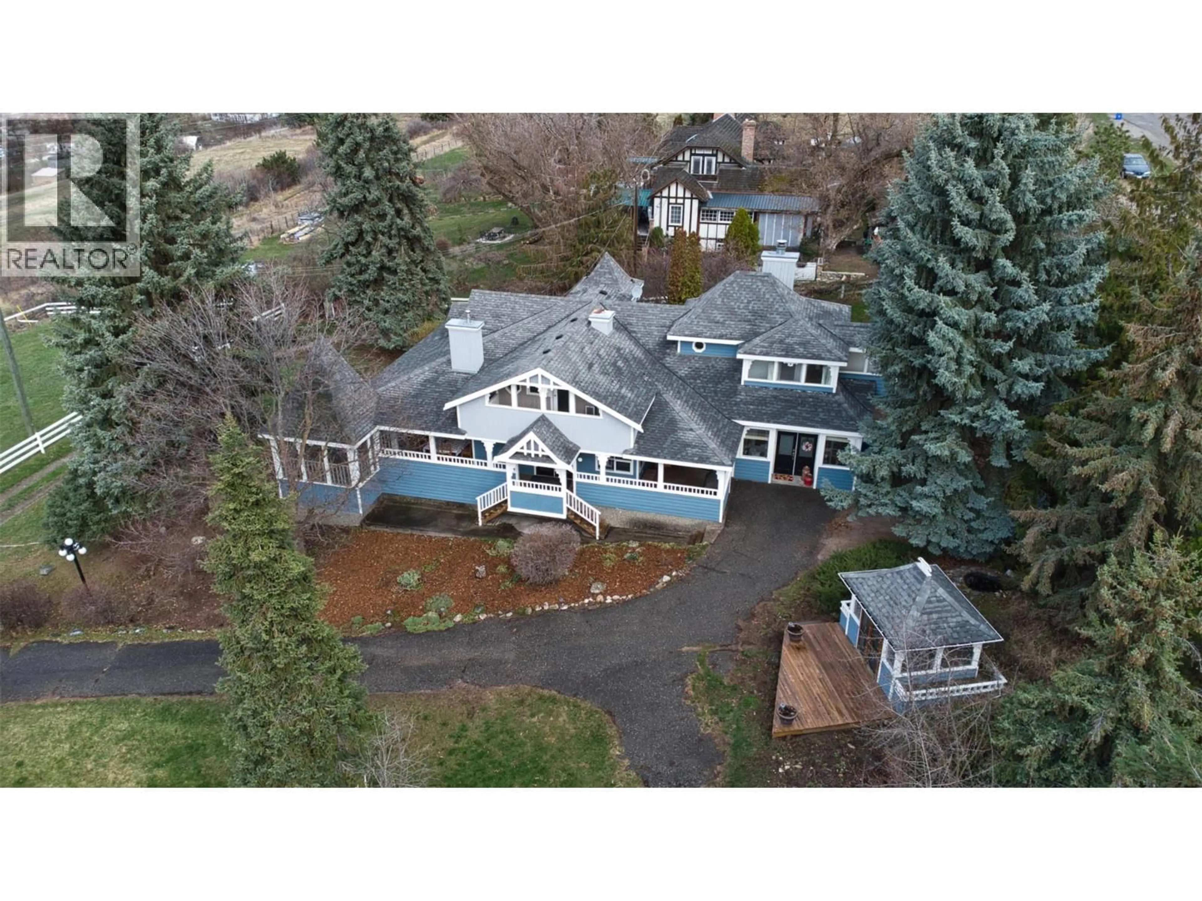 A pic from outside/outdoor area/front of a property/back of a property/a pic from drone, mountain view for 6926 RUGG ROAD, Vernon British Columbia V1B3S9