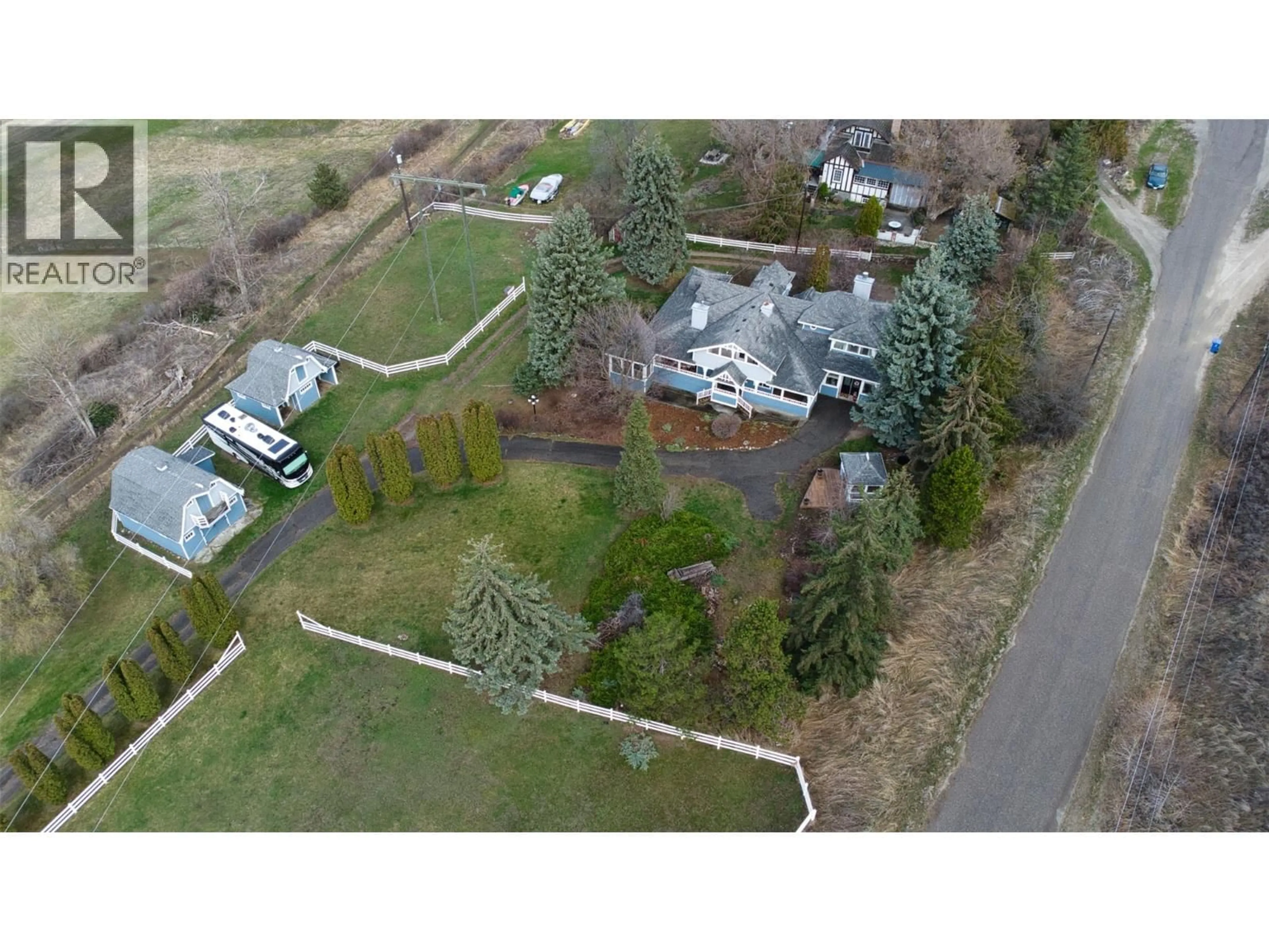 A pic from outside/outdoor area/front of a property/back of a property/a pic from drone, street for 6926 RUGG ROAD, Vernon British Columbia V1B3S9