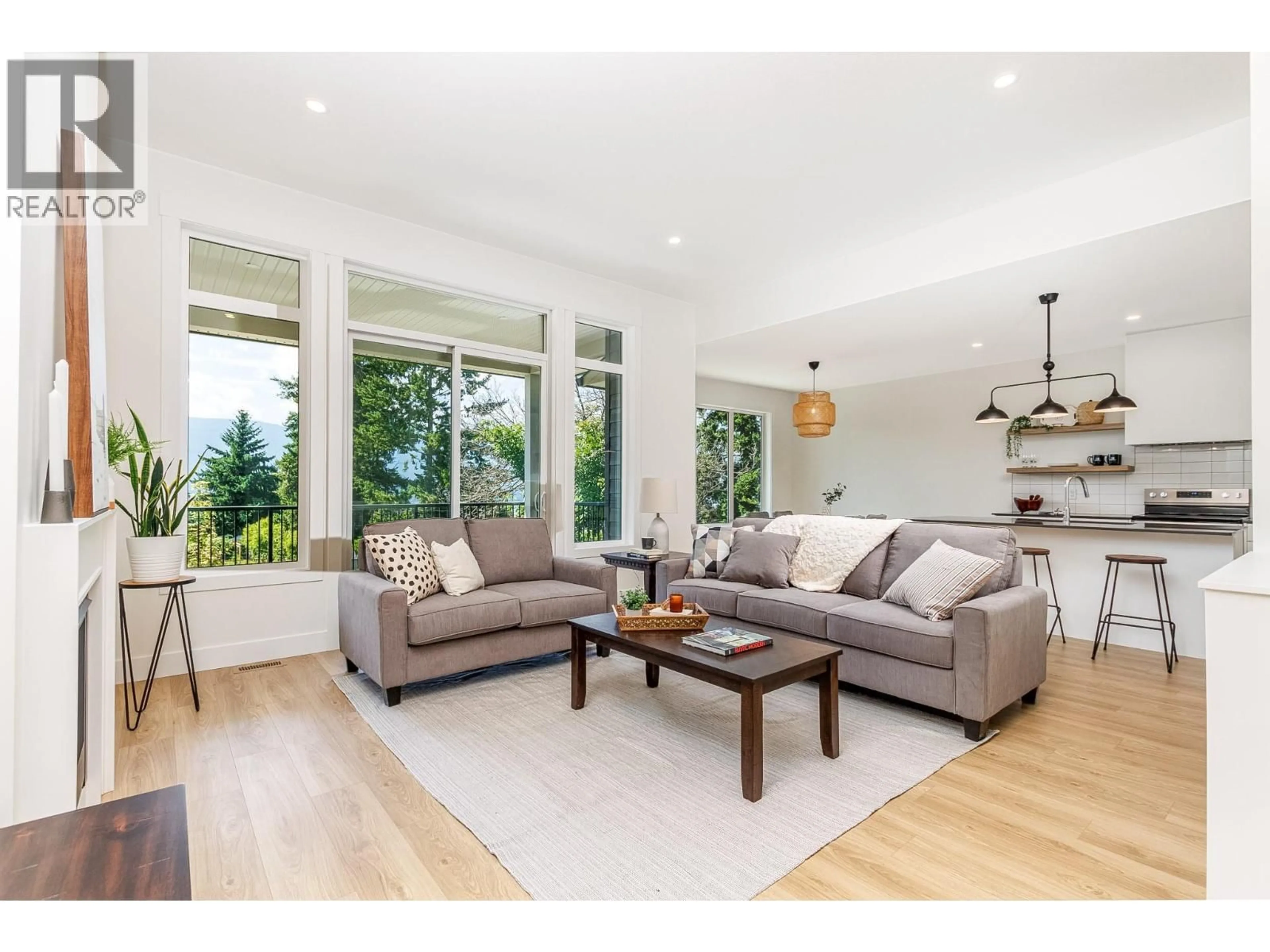 Living room with furniture, wood/laminate floor for 111 20 STREET SOUTHEAST, Salmon Arm British Columbia V1E1T8