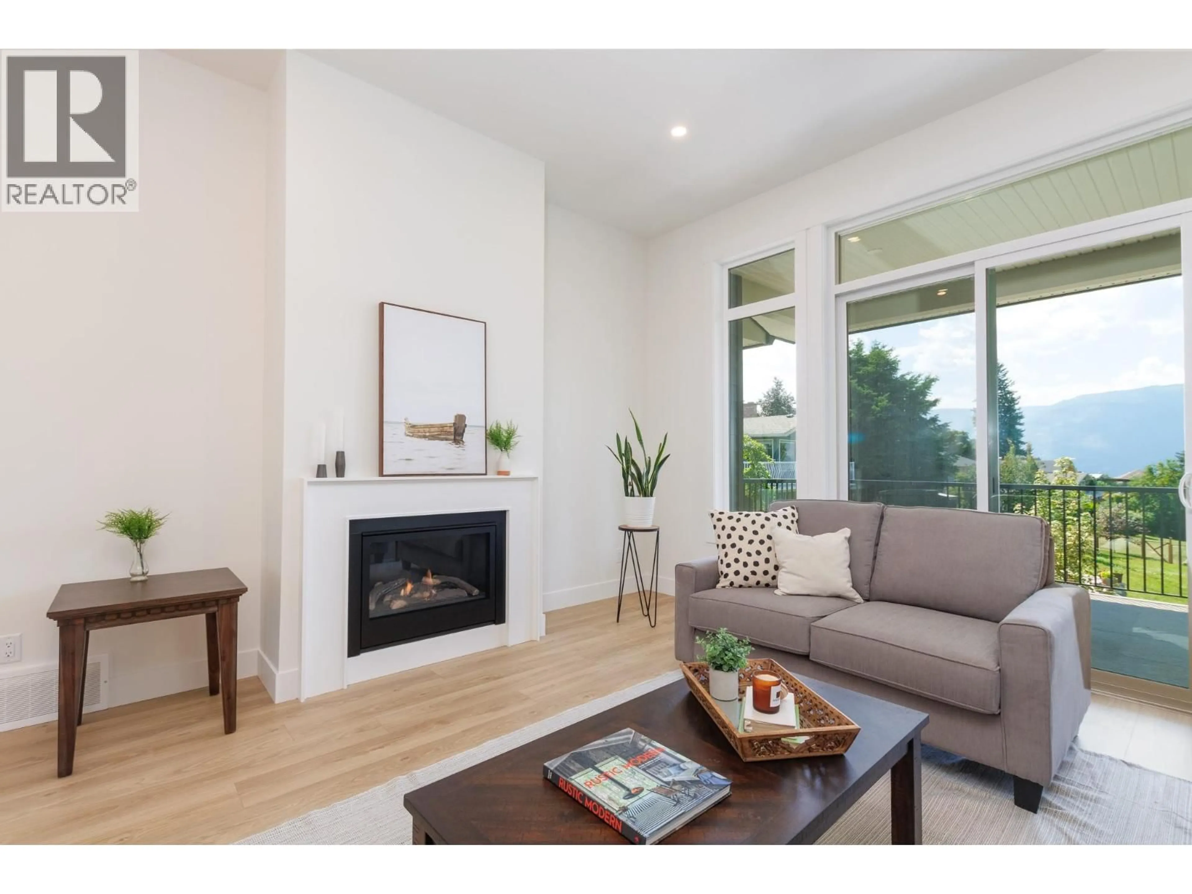 Living room with furniture, wood/laminate floor for 111 20 STREET SOUTHEAST, Salmon Arm British Columbia V1E1T8