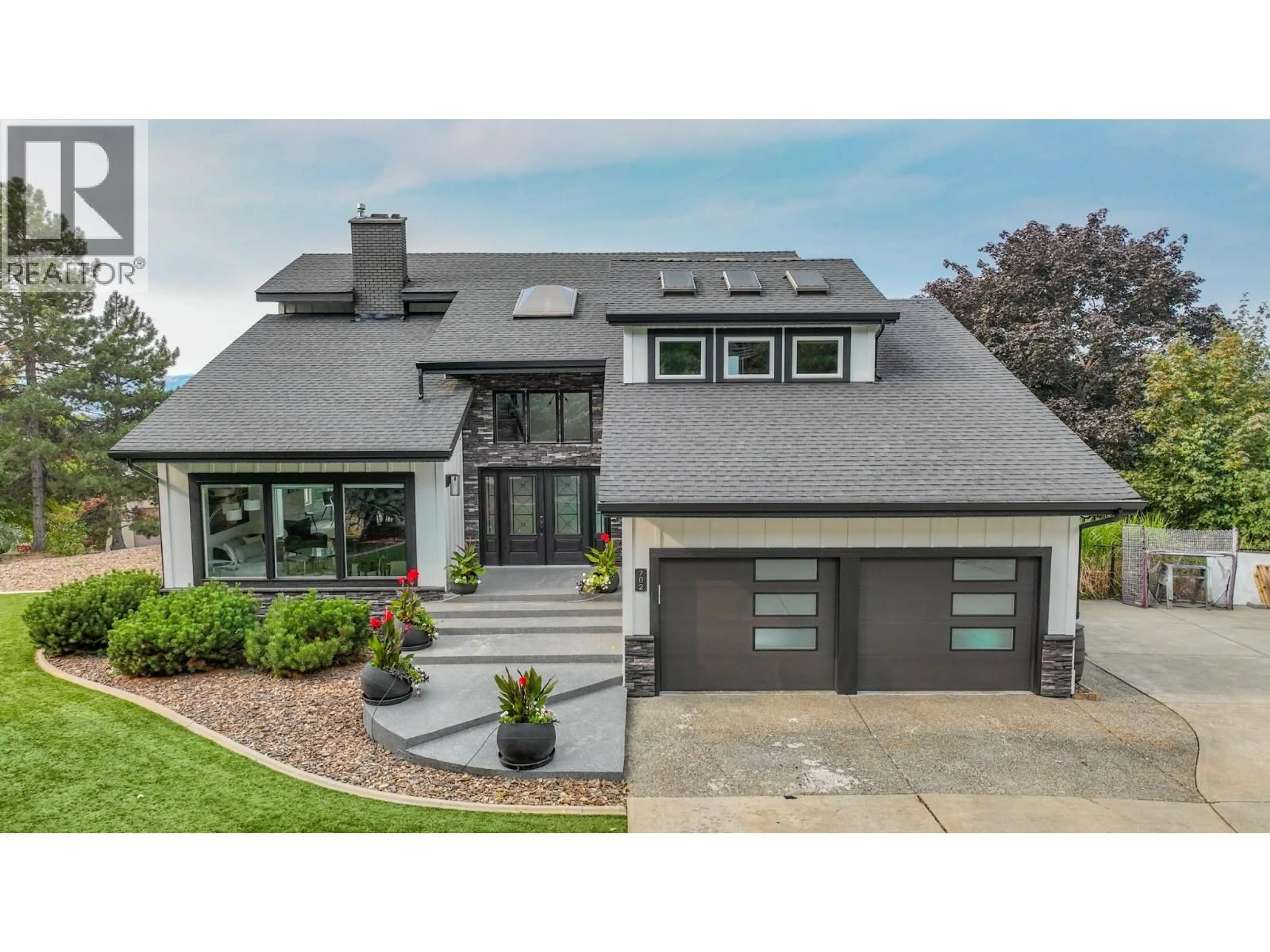 Home with vinyl exterior material, street for 702 CYPRESS DRIVE, Coldstream British Columbia V1B2X9