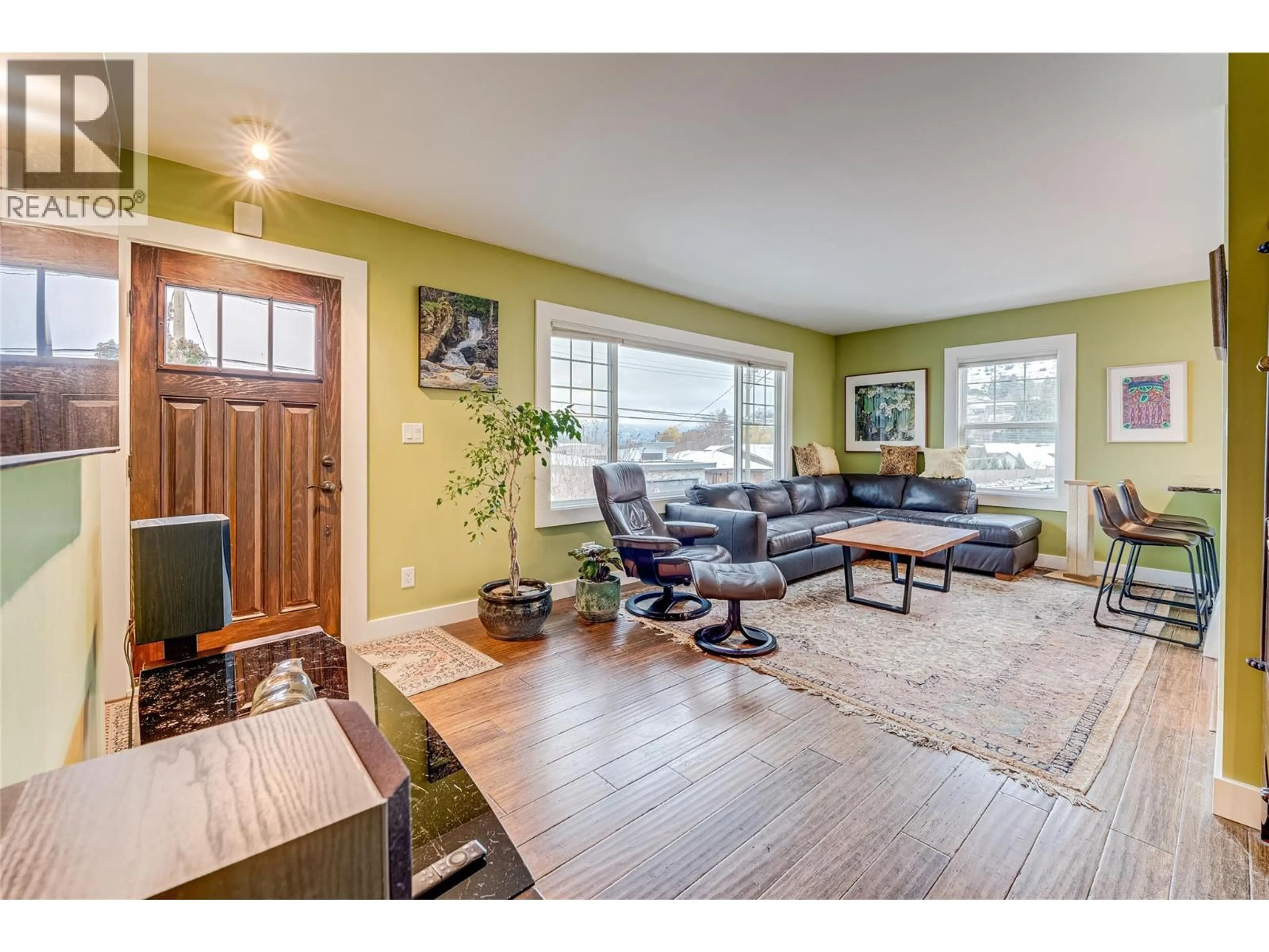 Living room with furniture, wood/laminate floor for 13505 WESTKAL ROAD, Coldstream British Columbia V1B1Y7