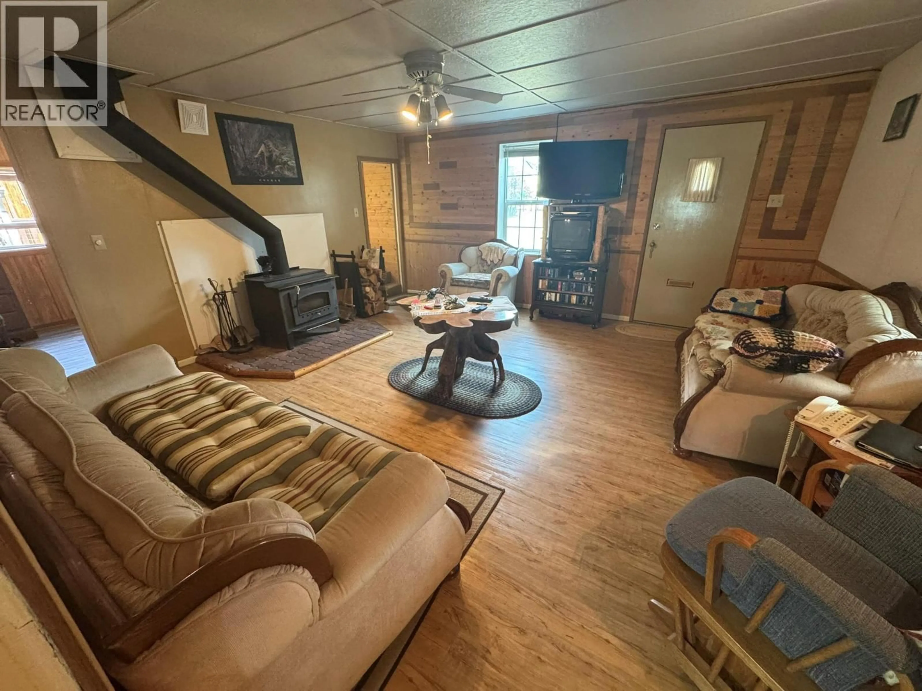 Living room with furniture, wood/laminate floor for 2614 OTTER AVENUE, Coalmont-Tulameen British Columbia V0X1W0