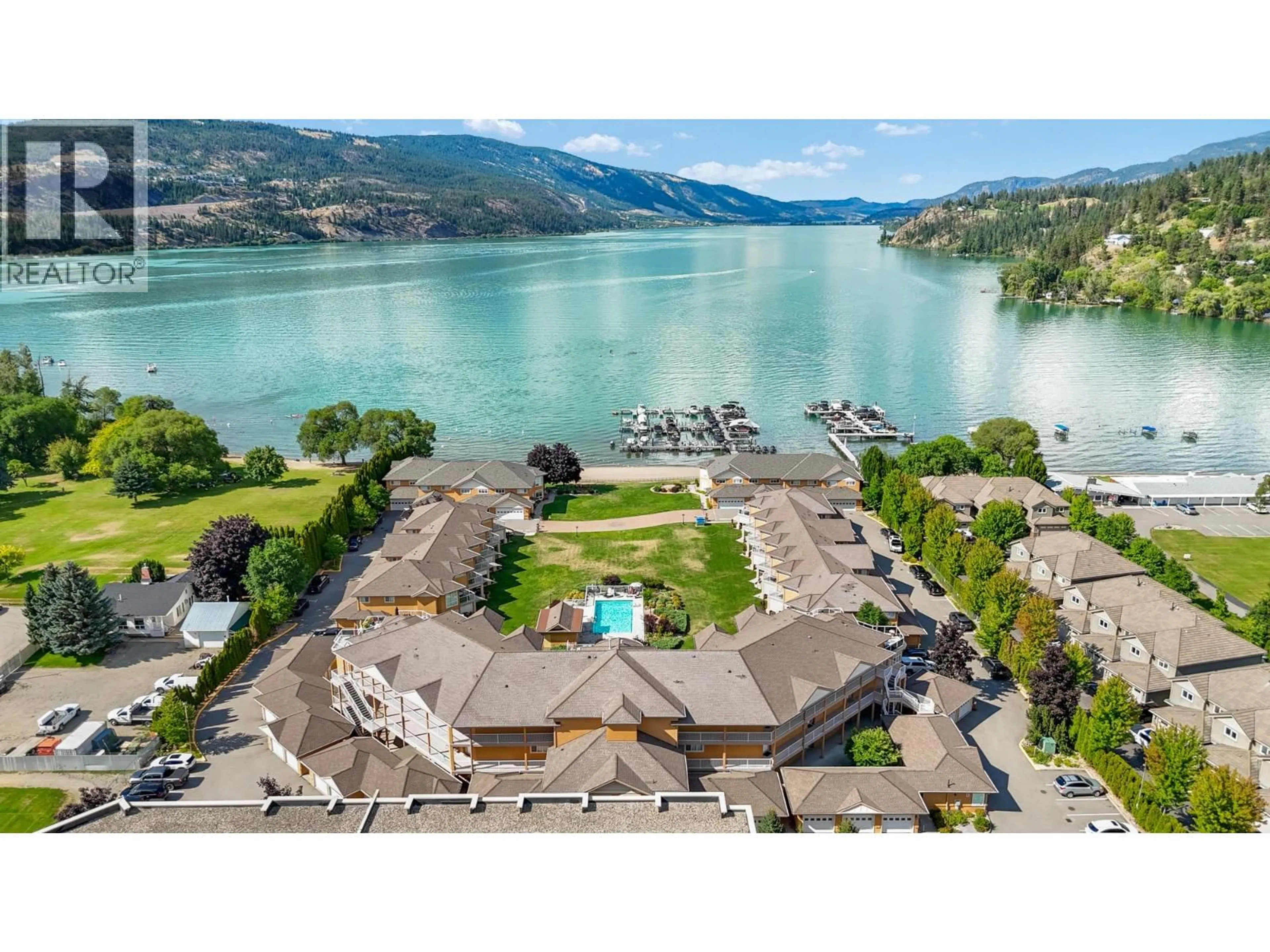 A pic from outside/outdoor area/front of a property/back of a property/a pic from drone, water/lake/river/ocean view for 303 - 3570 WOODSDALE ROAD, Lake Country British Columbia V4V1Y9