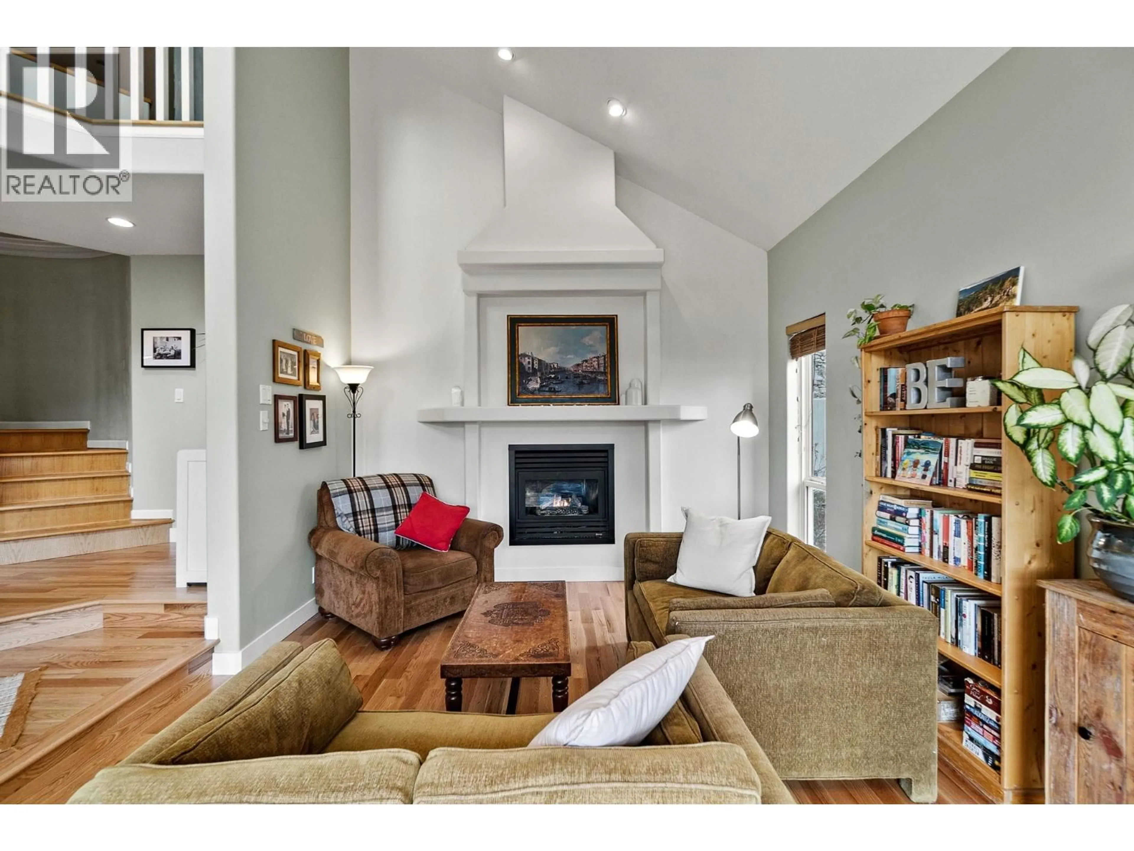 Living room with furniture, wood/laminate floor for 712 CREEKSIDE ROAD, Penticton British Columbia V2A2C4