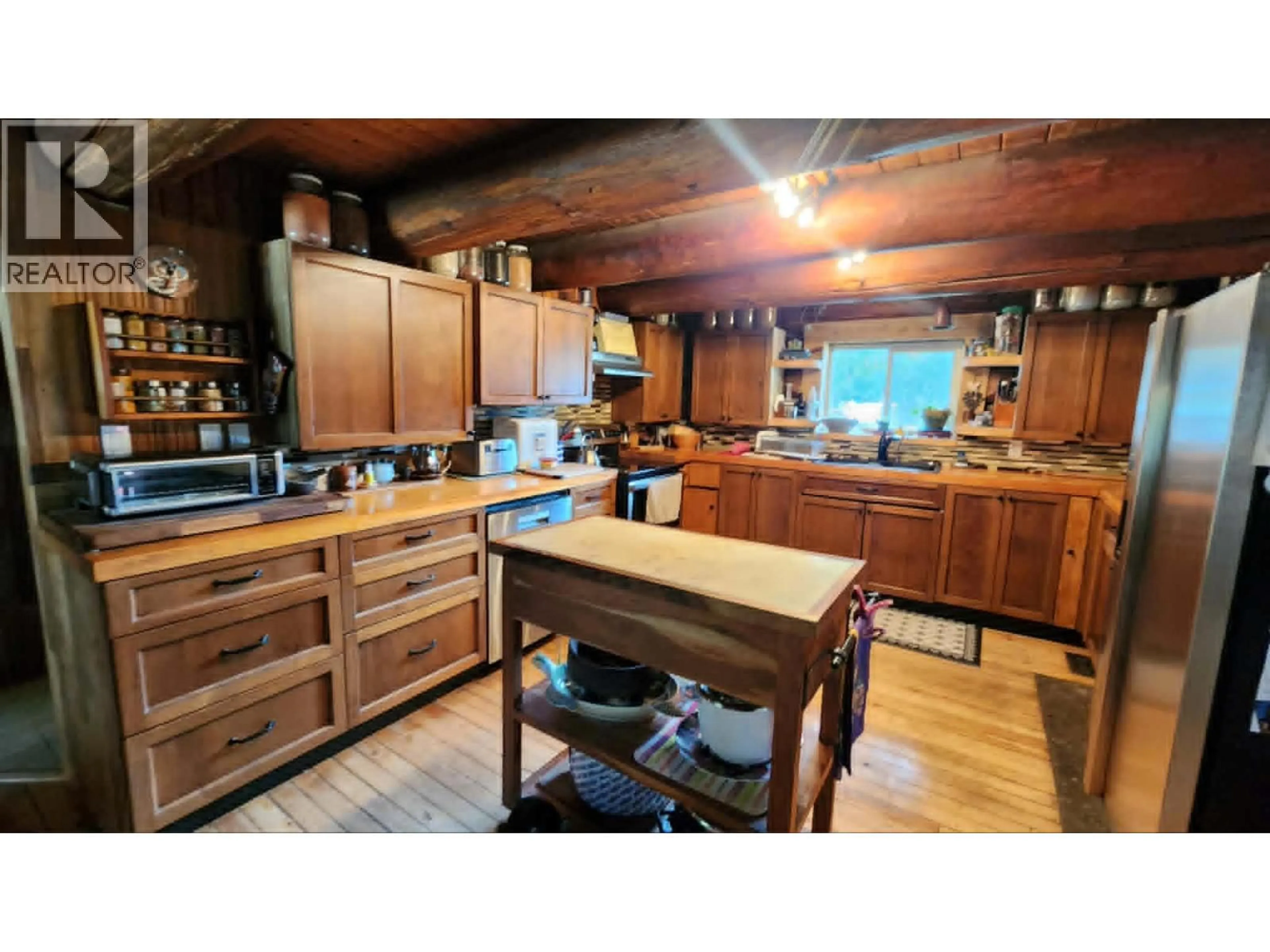 Rustic kitchen, wood/laminate floor for 63 BEGBIE ROAD, Cherryville British Columbia V0E2G3