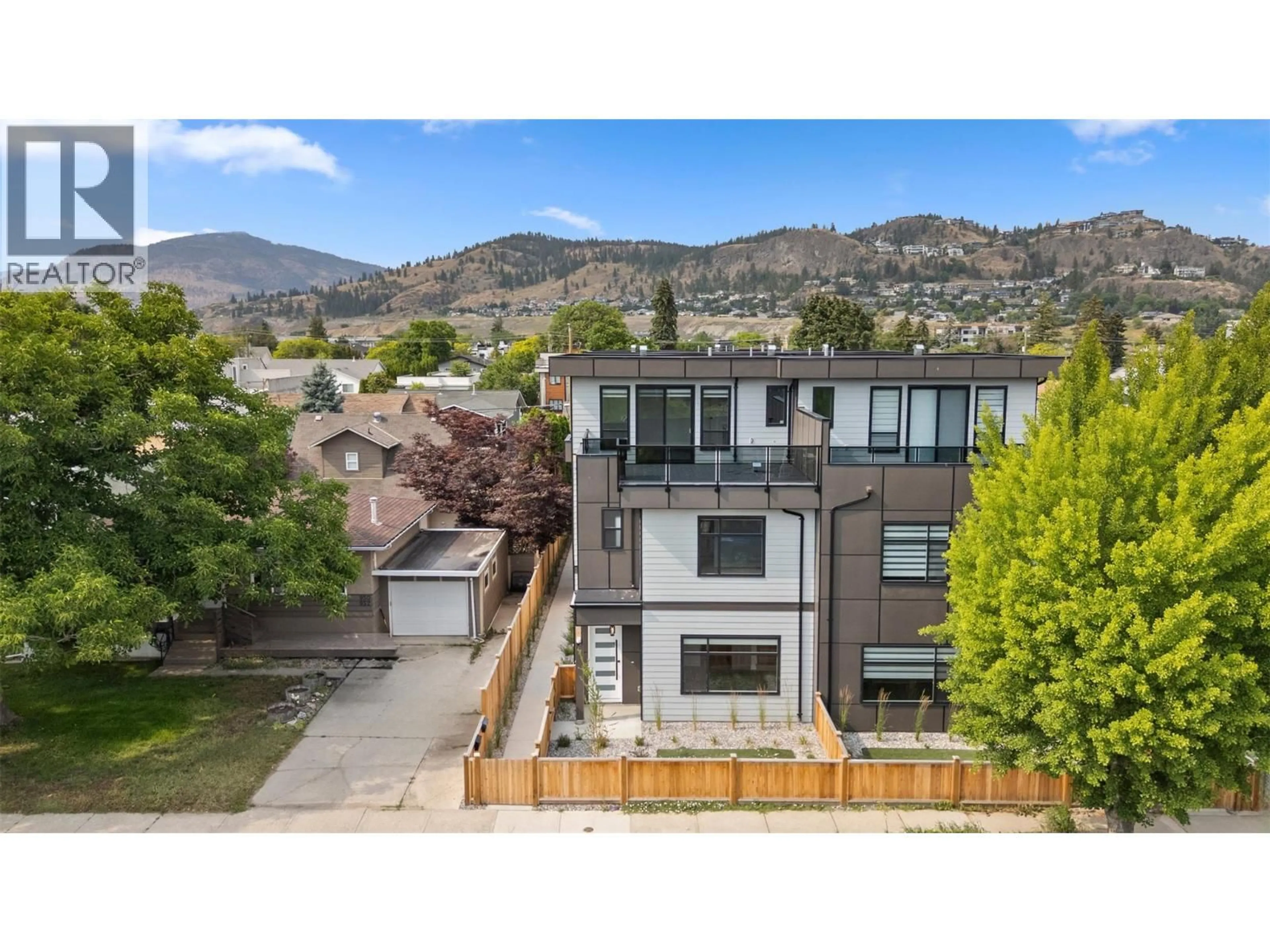 A pic from outside/outdoor area/front of a property/back of a property/a pic from drone, mountain view for 1 - 954 STOCKWELL AVENUE, Kelowna British Columbia V1Y6W2