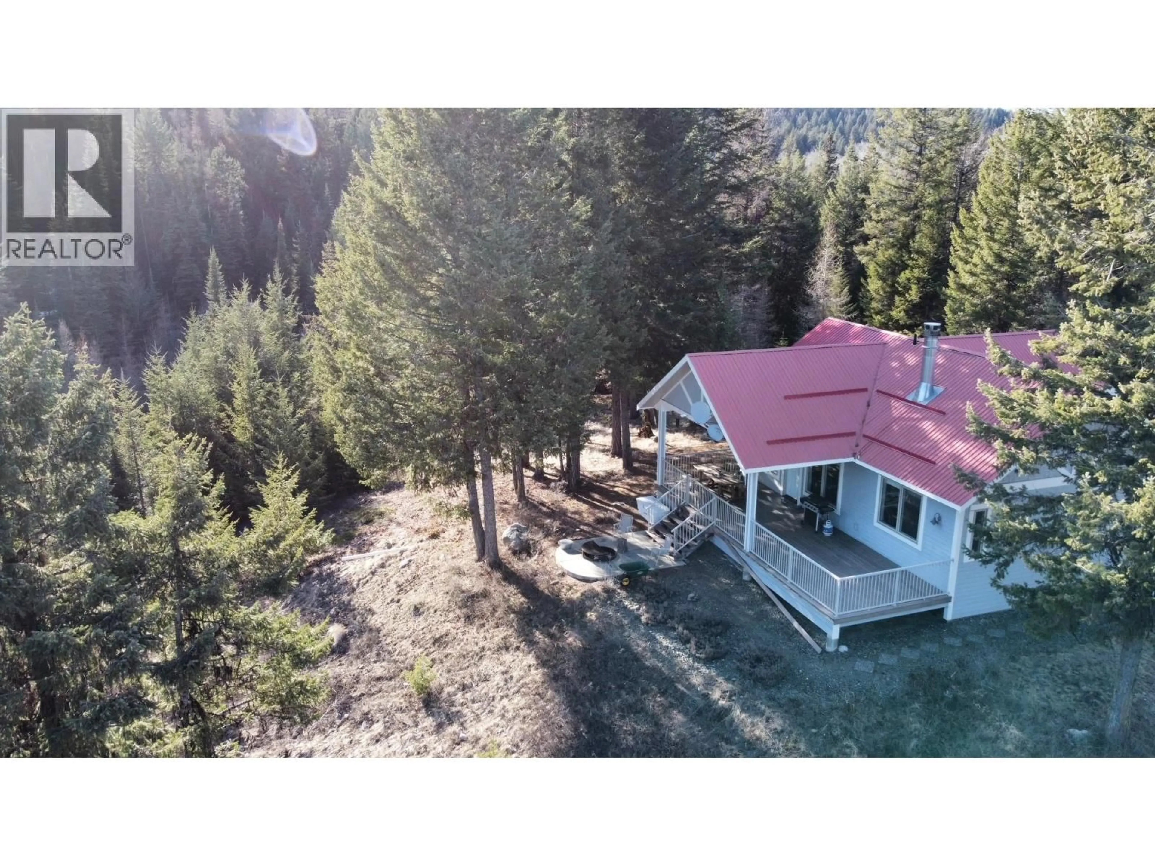 A pic from outside/outdoor area/front of a property/back of a property/a pic from drone, forest/trees view for 1475 COURTENAY BROWN ROAD, Bridesville British Columbia V0H1B0