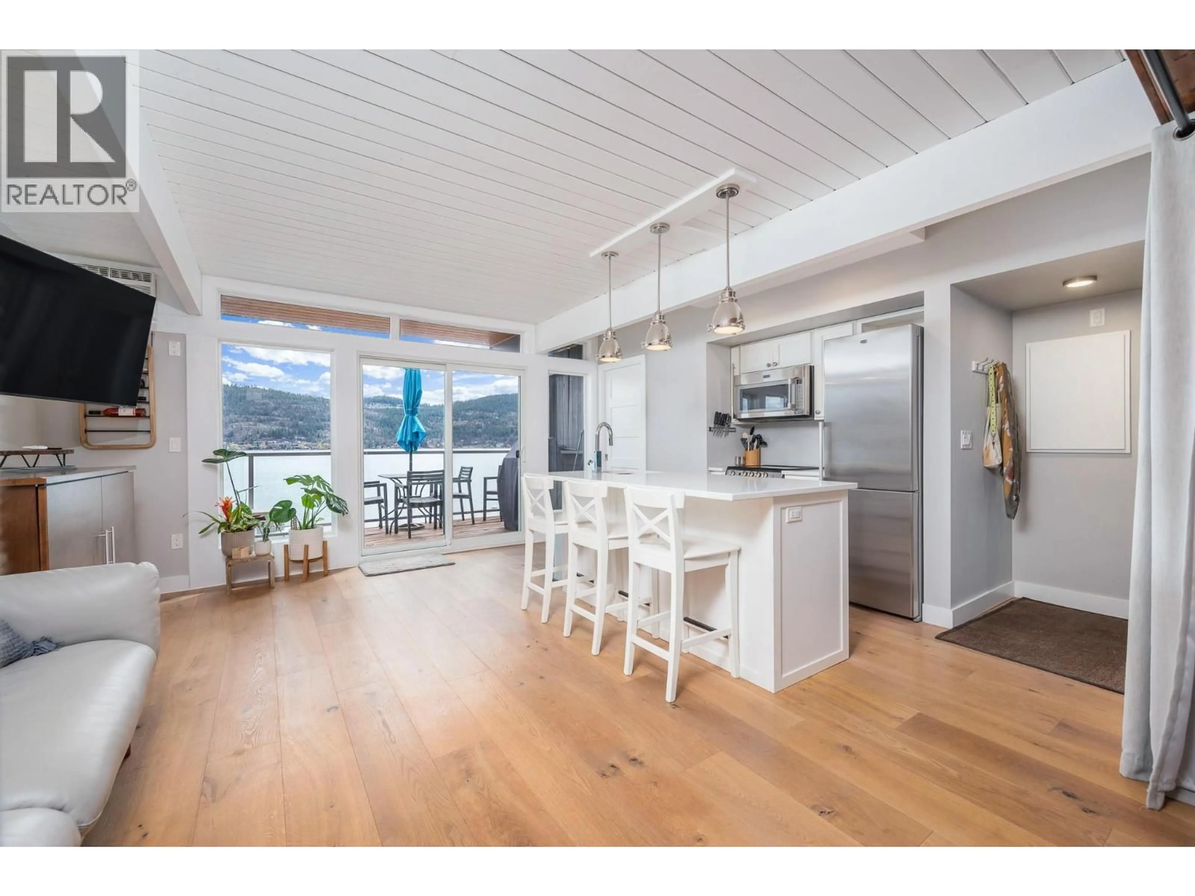 Open concept kitchen, wood/laminate floor for 4 - 8800 ADVENTURE BAY ROAD, Vernon British Columbia V1H1E6