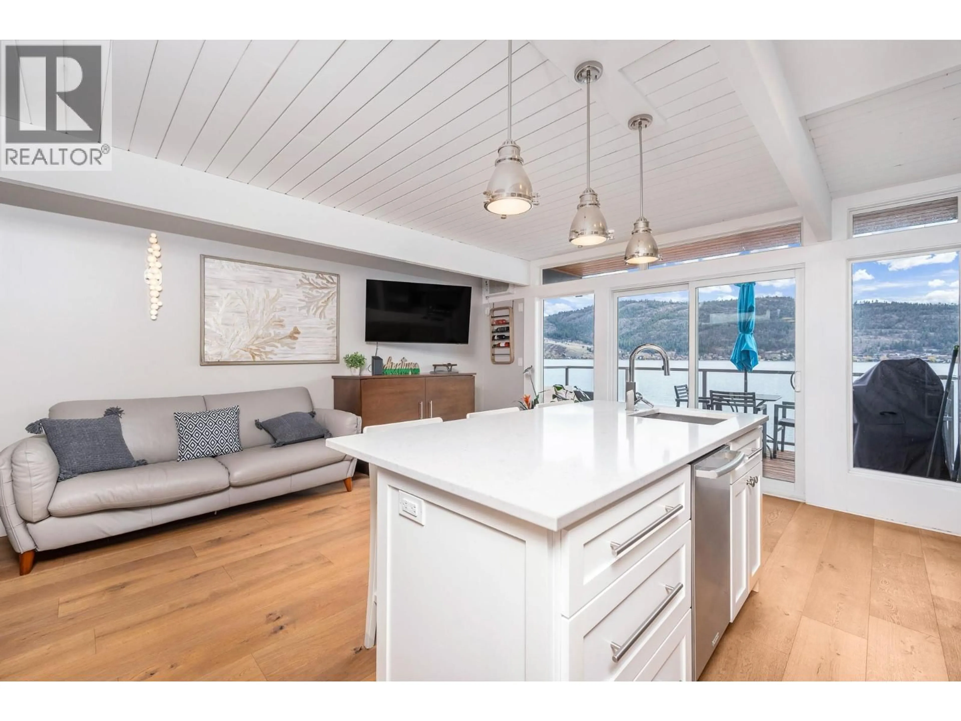 Open concept kitchen, wood/laminate floor for 4 - 8800 ADVENTURE BAY ROAD, Vernon British Columbia V1H1E6