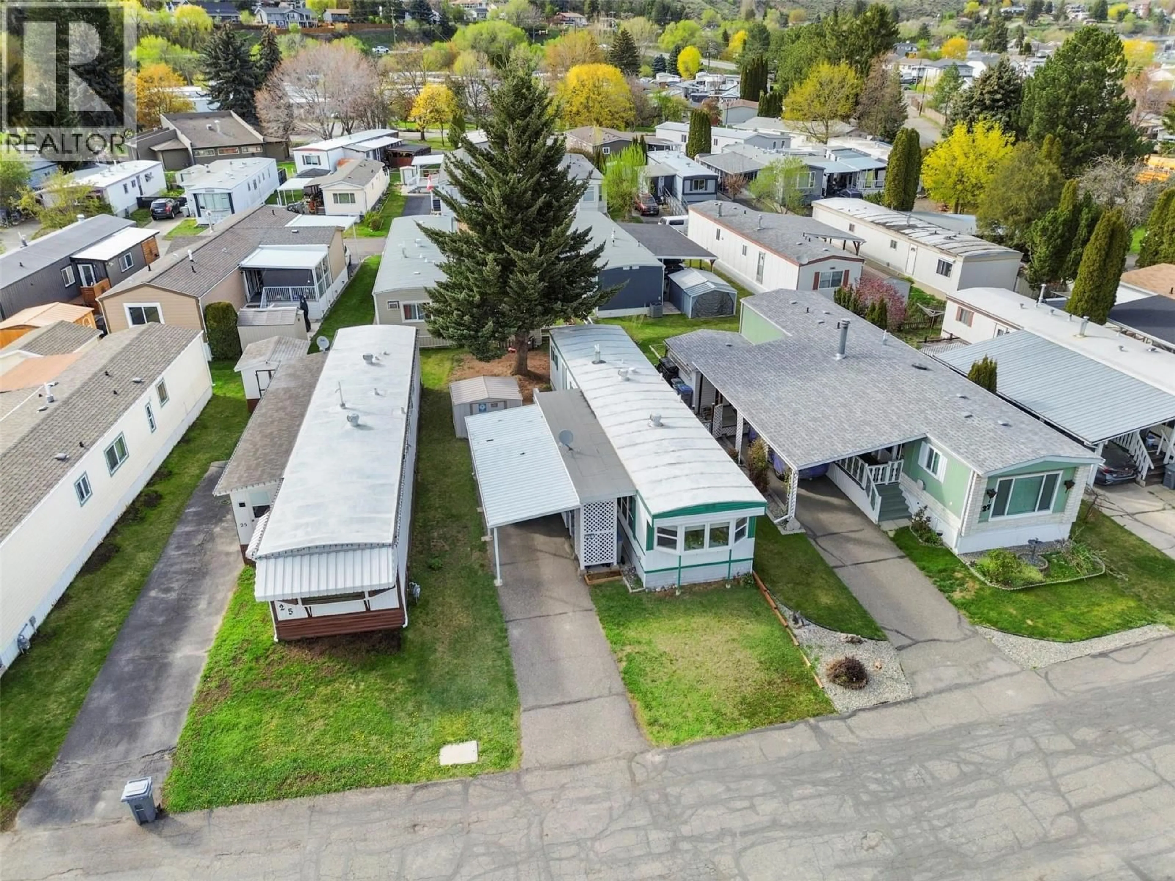 A pic from outside/outdoor area/front of a property/back of a property/a pic from drone, street for 26 - 2400 OAKDALE WAY, Kamloops British Columbia v2b6w6