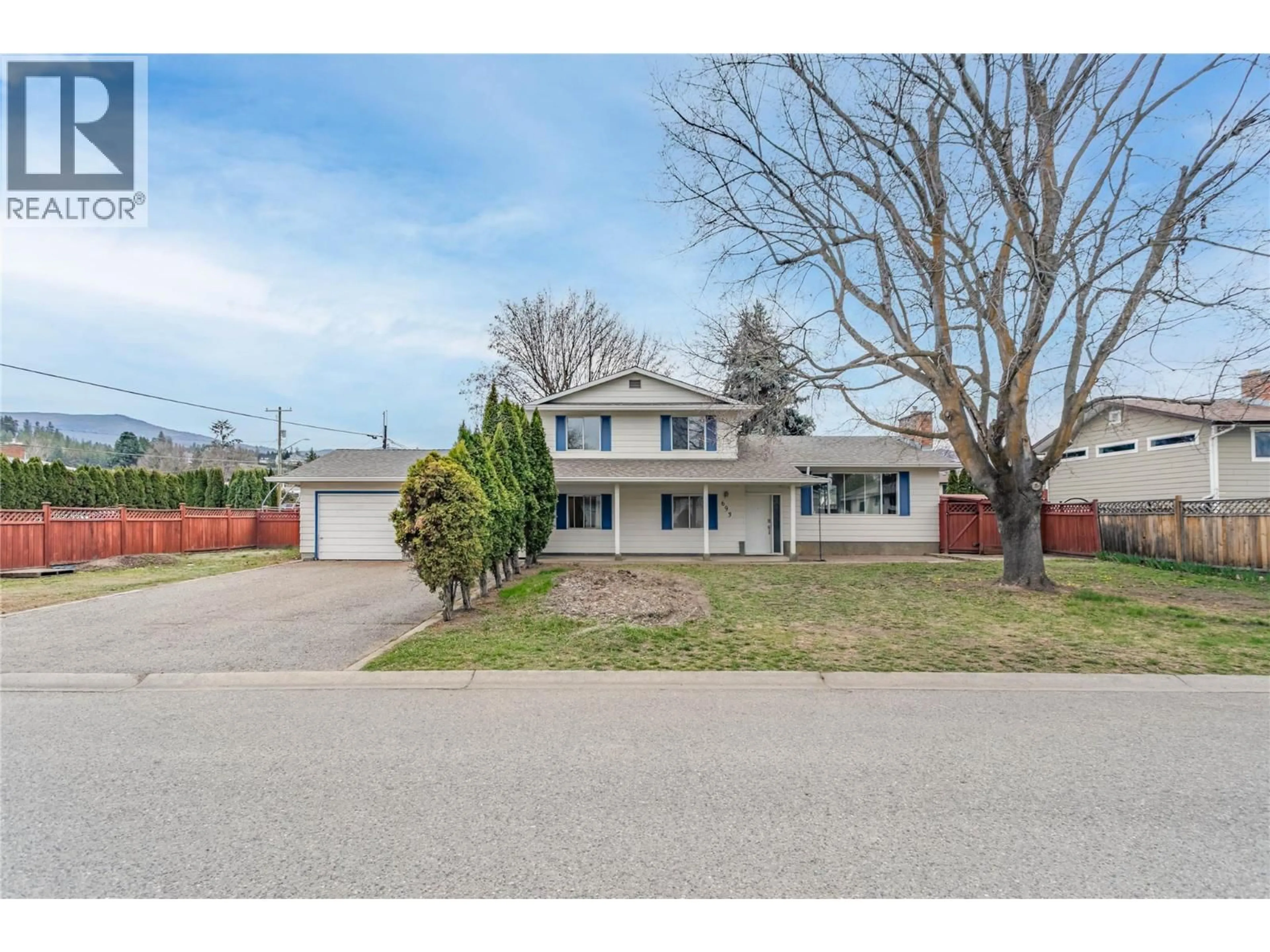 A pic from outside/outdoor area/front of a property/back of a property/a pic from drone, street for 693 PARET PLACE, Kelowna British Columbia V1W2K6