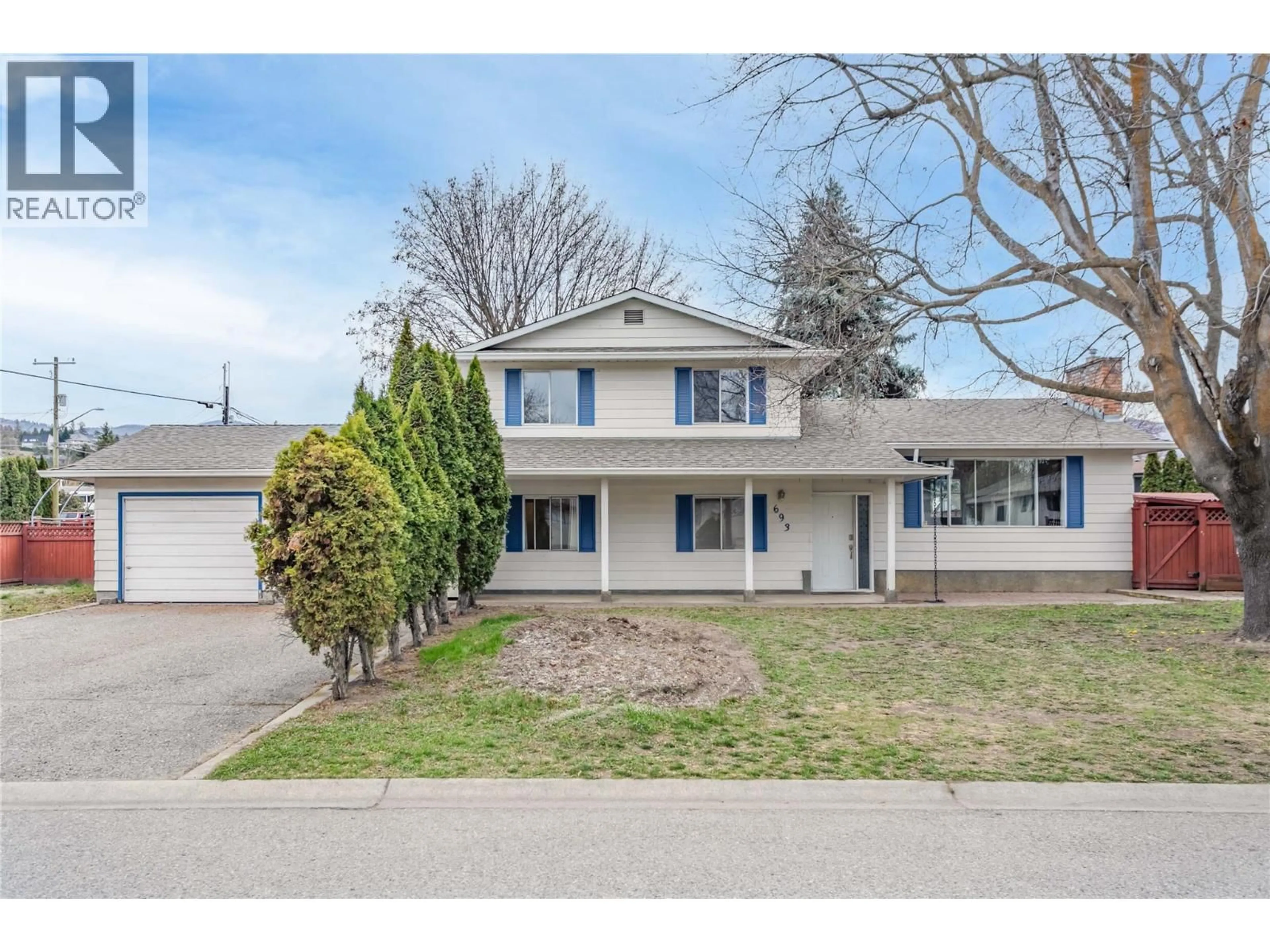 A pic from outside/outdoor area/front of a property/back of a property/a pic from drone, street for 693 PARET PLACE, Kelowna British Columbia V1W2K6