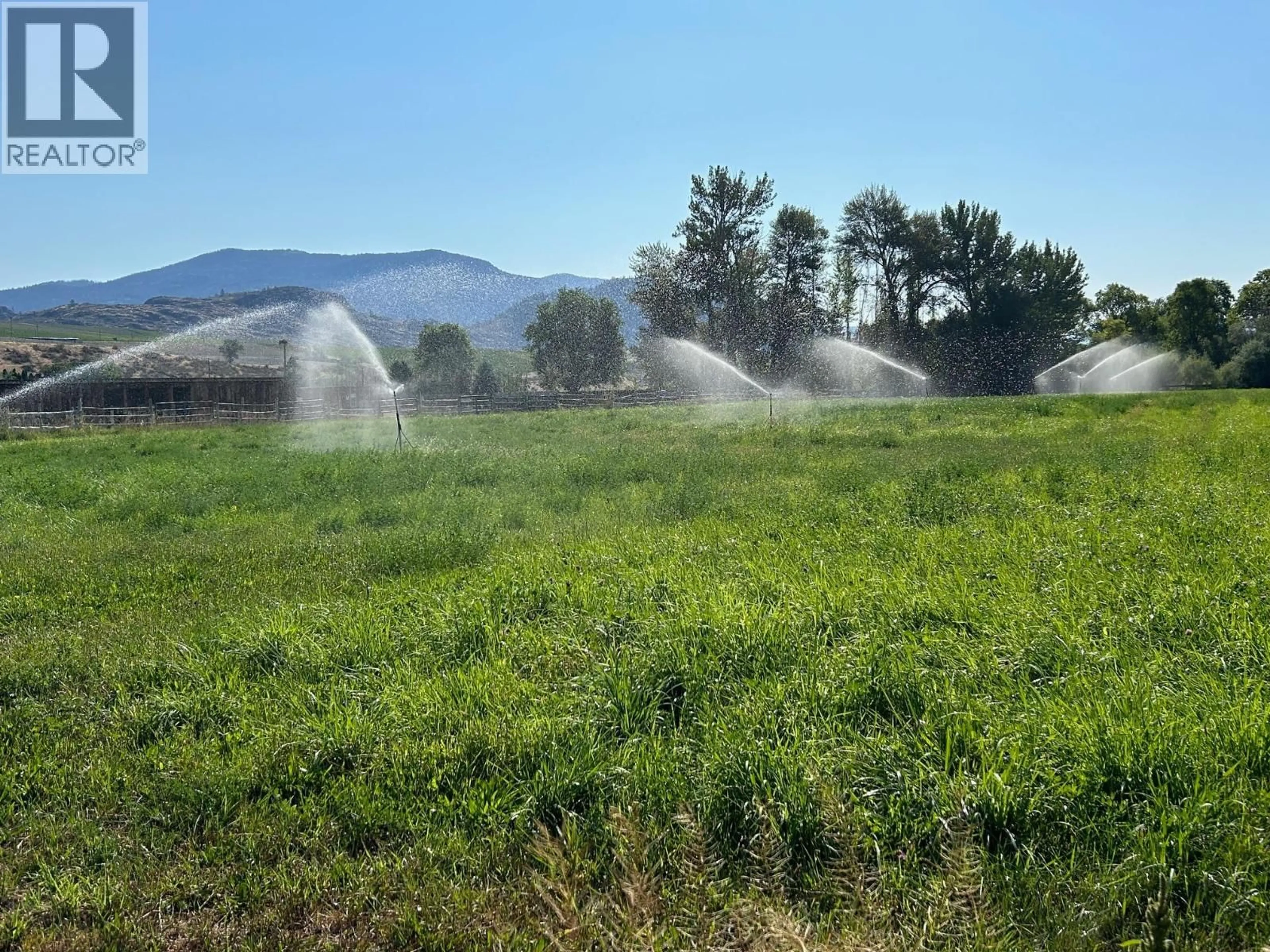 A pic from outside/outdoor area/front of a property/back of a property/a pic from drone, mountain view for 205 GREASEWOOD AVENUE, Oliver British Columbia V0H1T1
