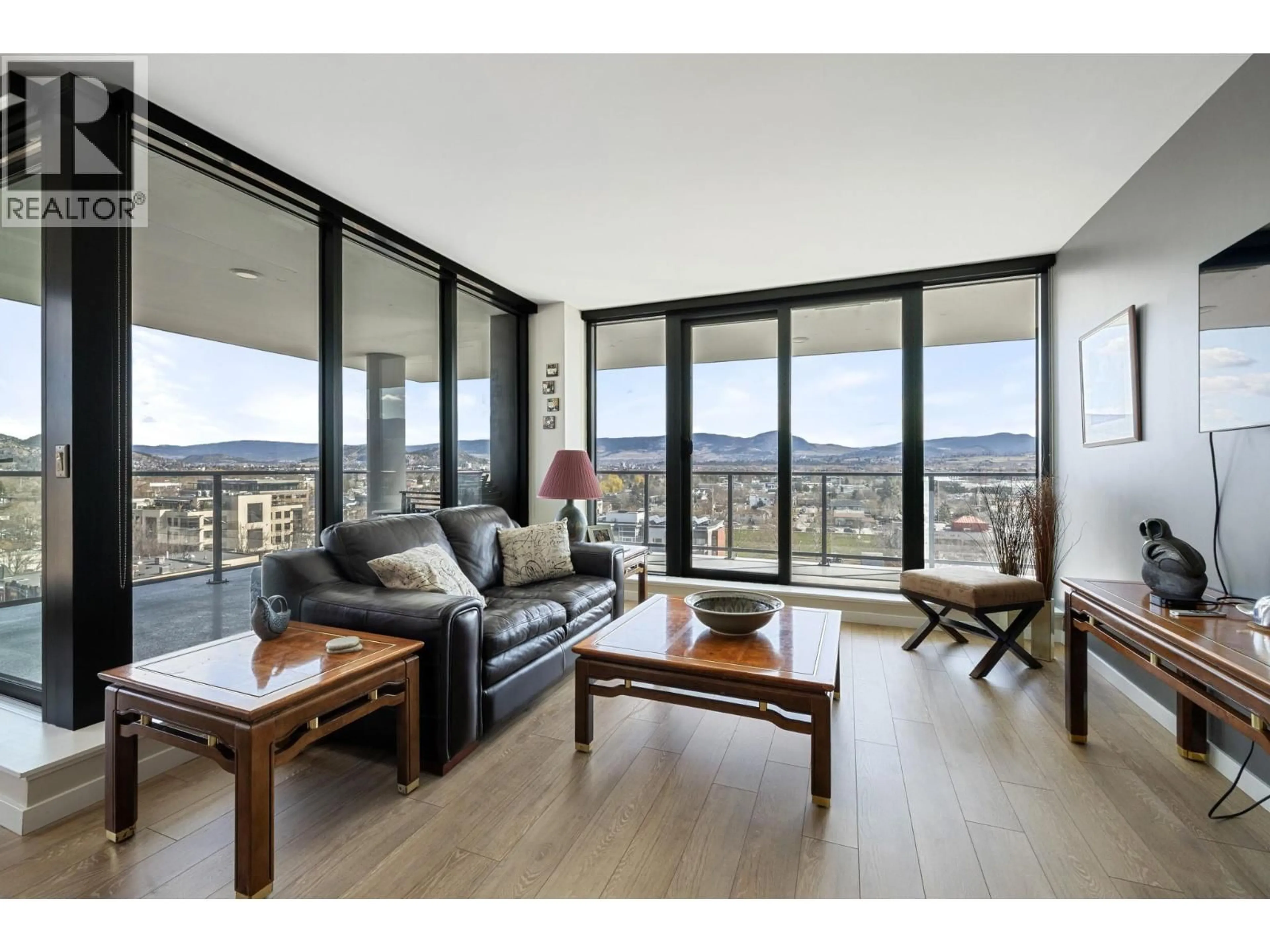 Living room with furniture, wood/laminate floor for 901 - 485 GROVES AVENUE, Kelowna British Columbia V1Y0C1