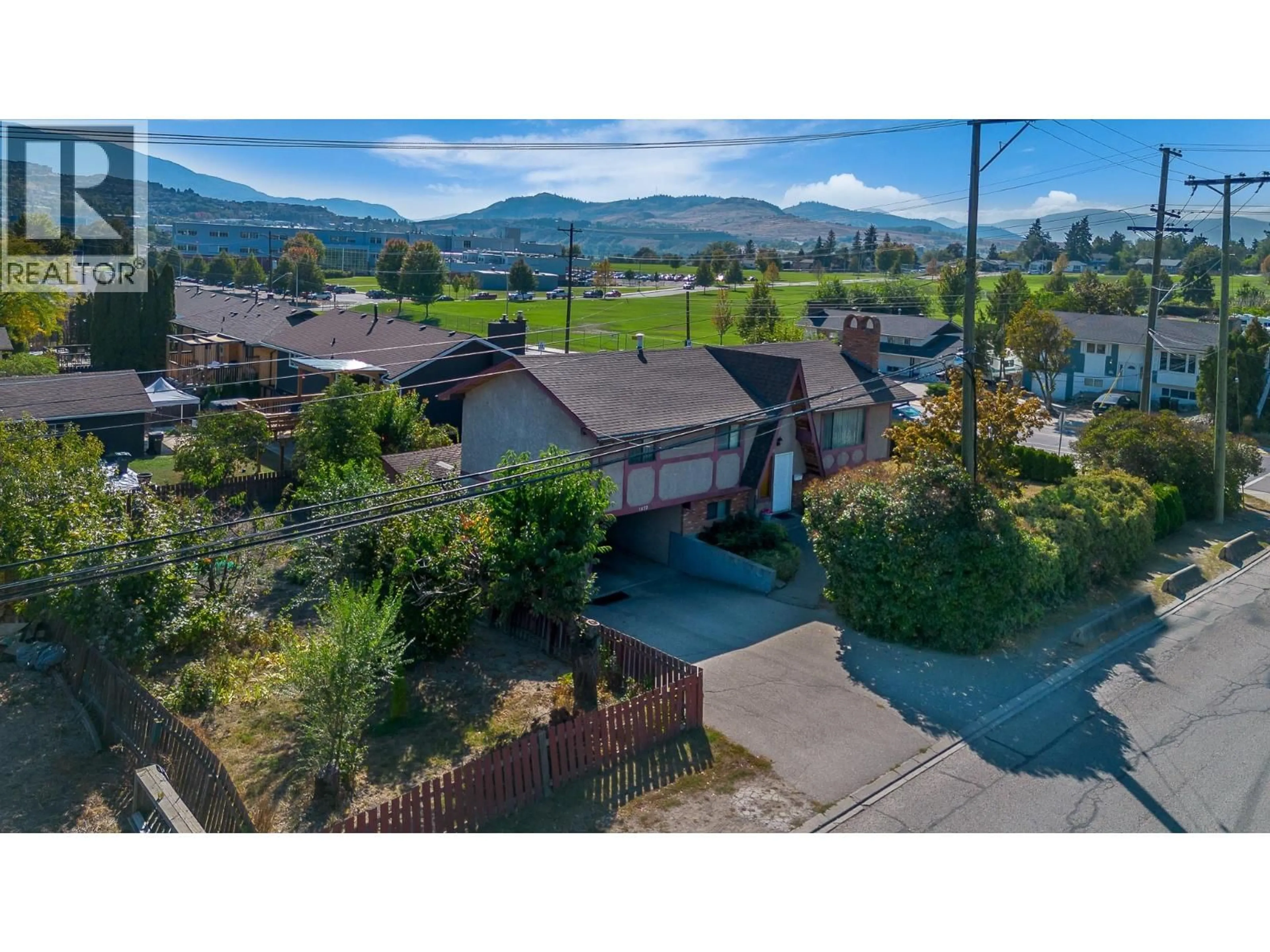 A pic from outside/outdoor area/front of a property/back of a property/a pic from drone, mountain view for 1472 25 AVENUE, Vernon British Columbia V1T1M5