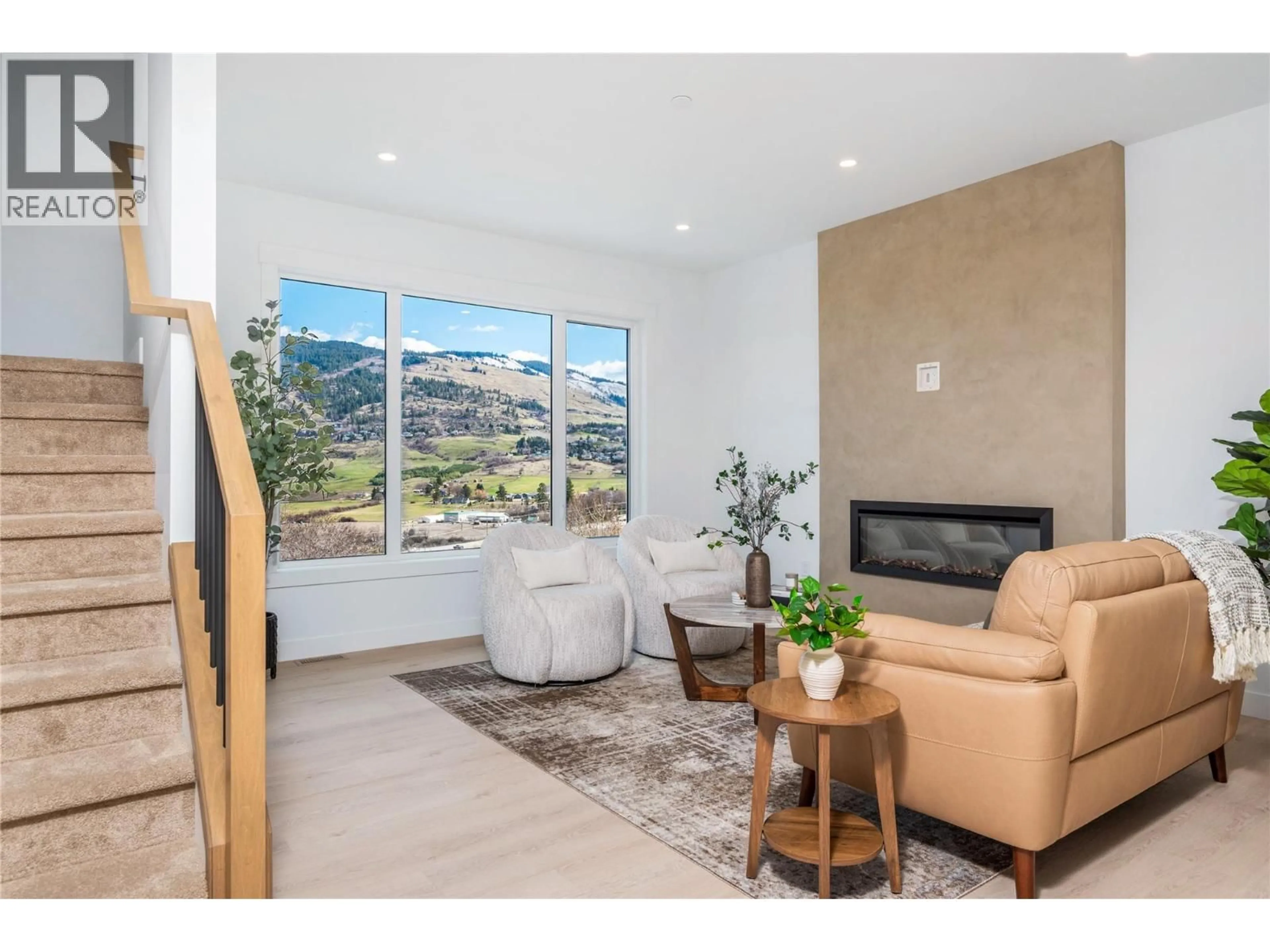 Living room with furniture, ceramic/tile floor for 473 MORNINGVIEW DRIVE, Coldstream British Columbia V1B2M4